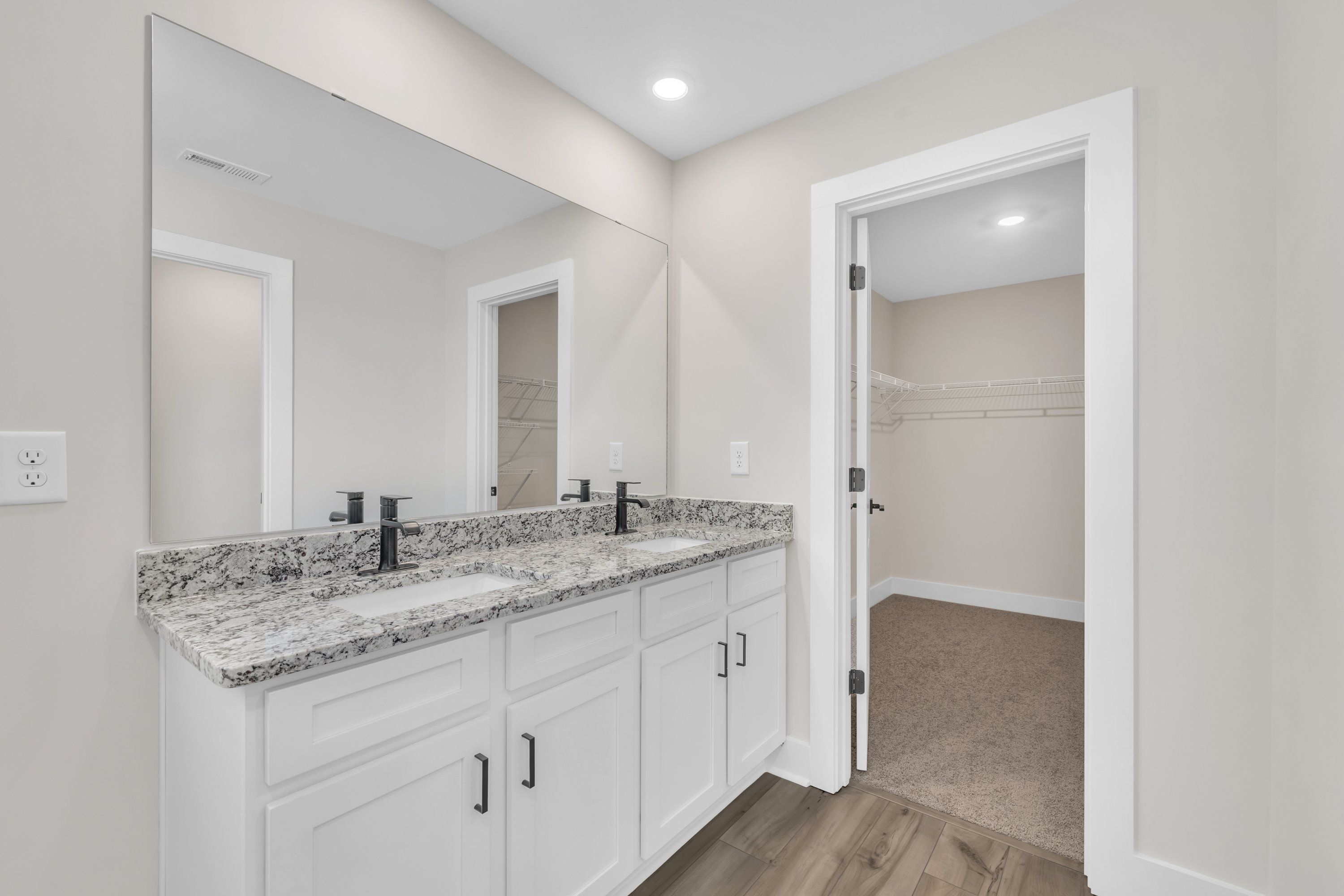 The master bathroom has double sinks. 