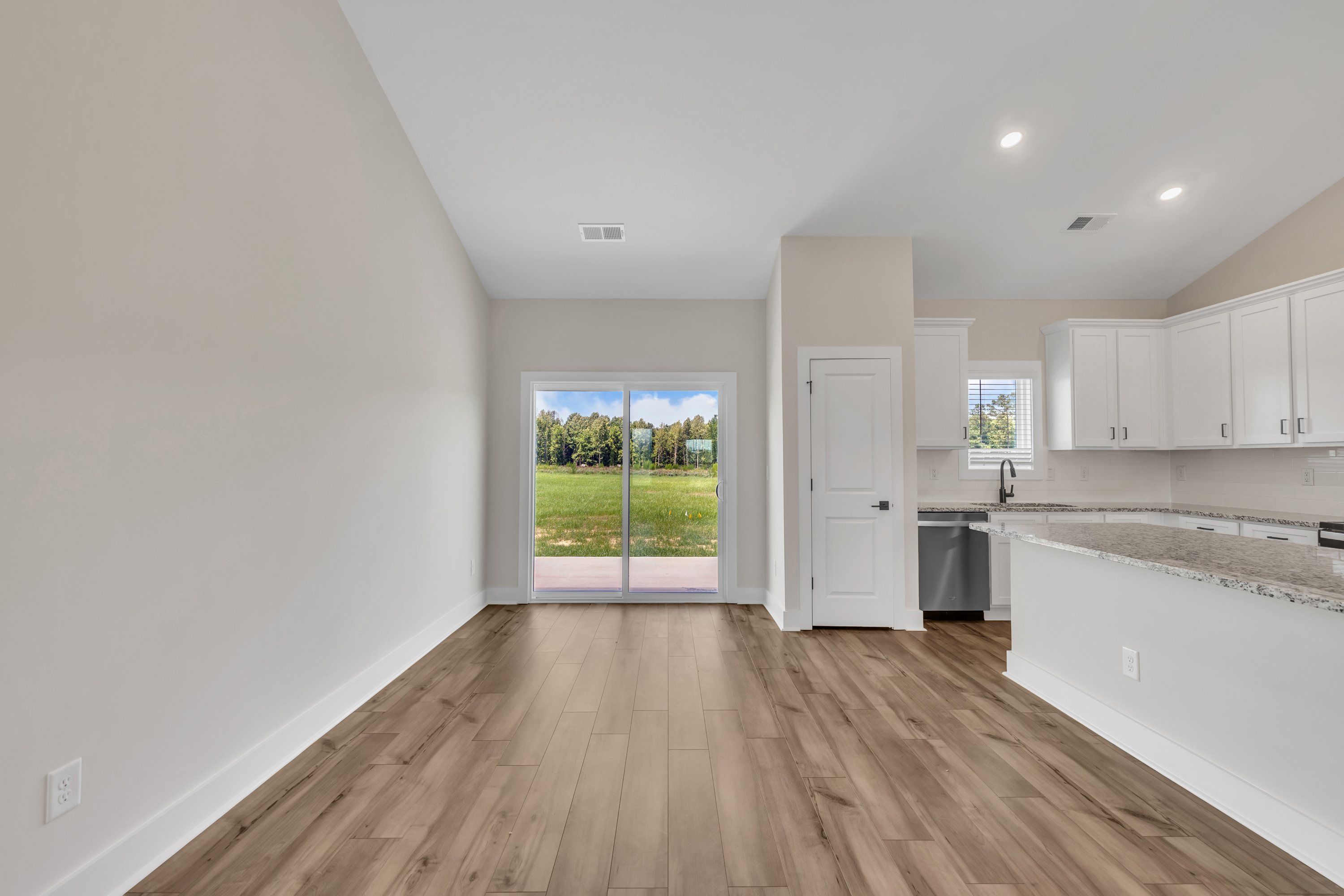 The dining area opens to the backyard. 