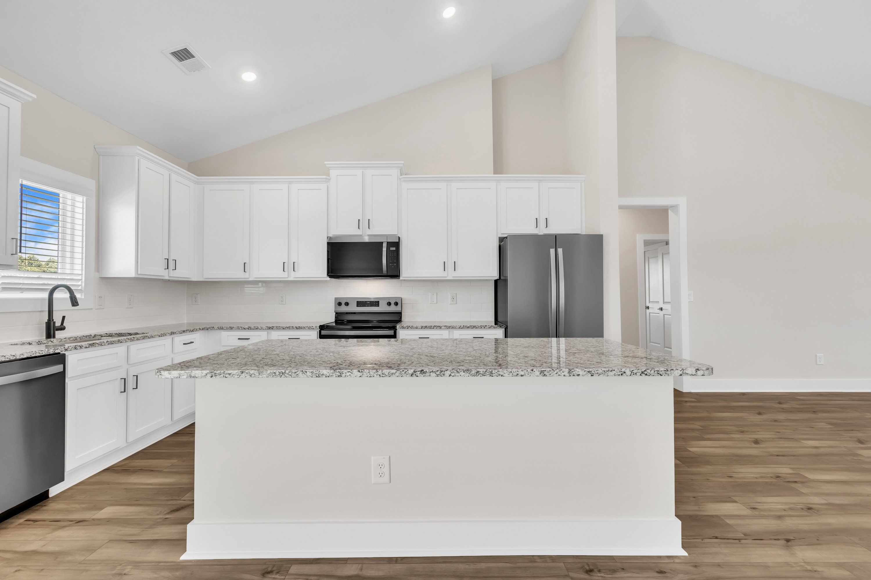 The kitchen comes with brand-new stainless-steel appliances.