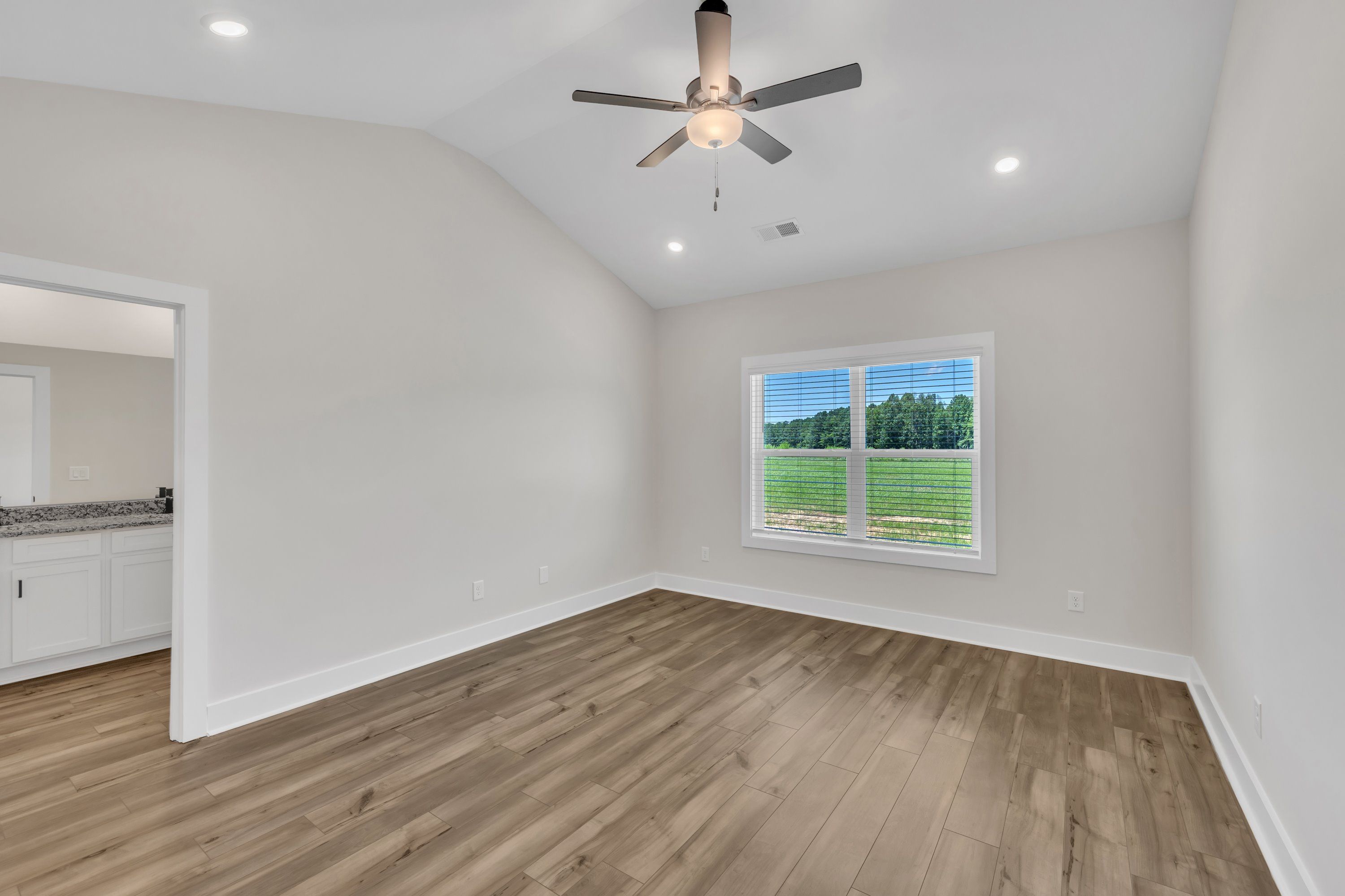 The master bedroom has ample space for your king-sized furniture. 