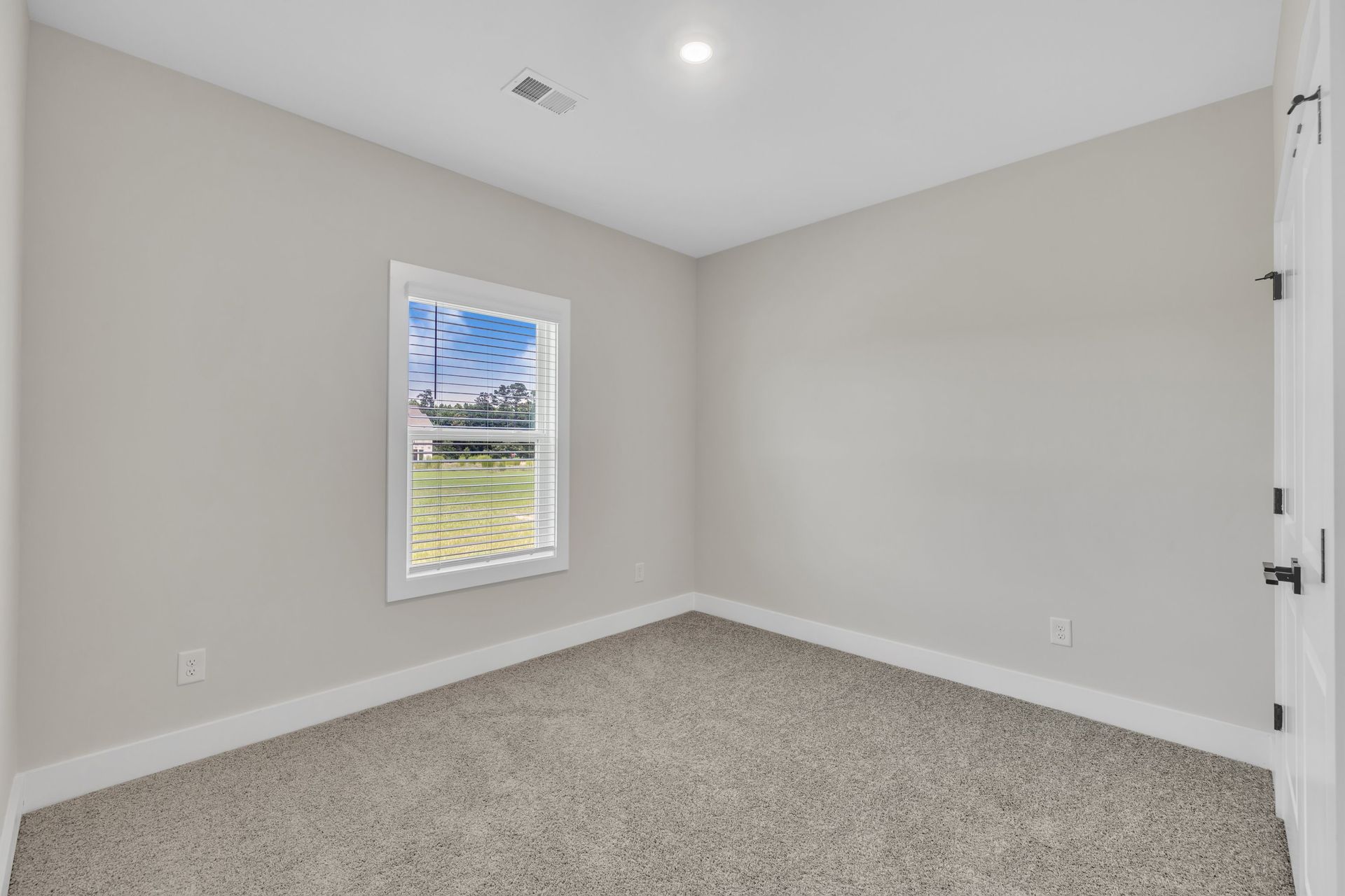 Windows let in lots of light to each bedroom. 
