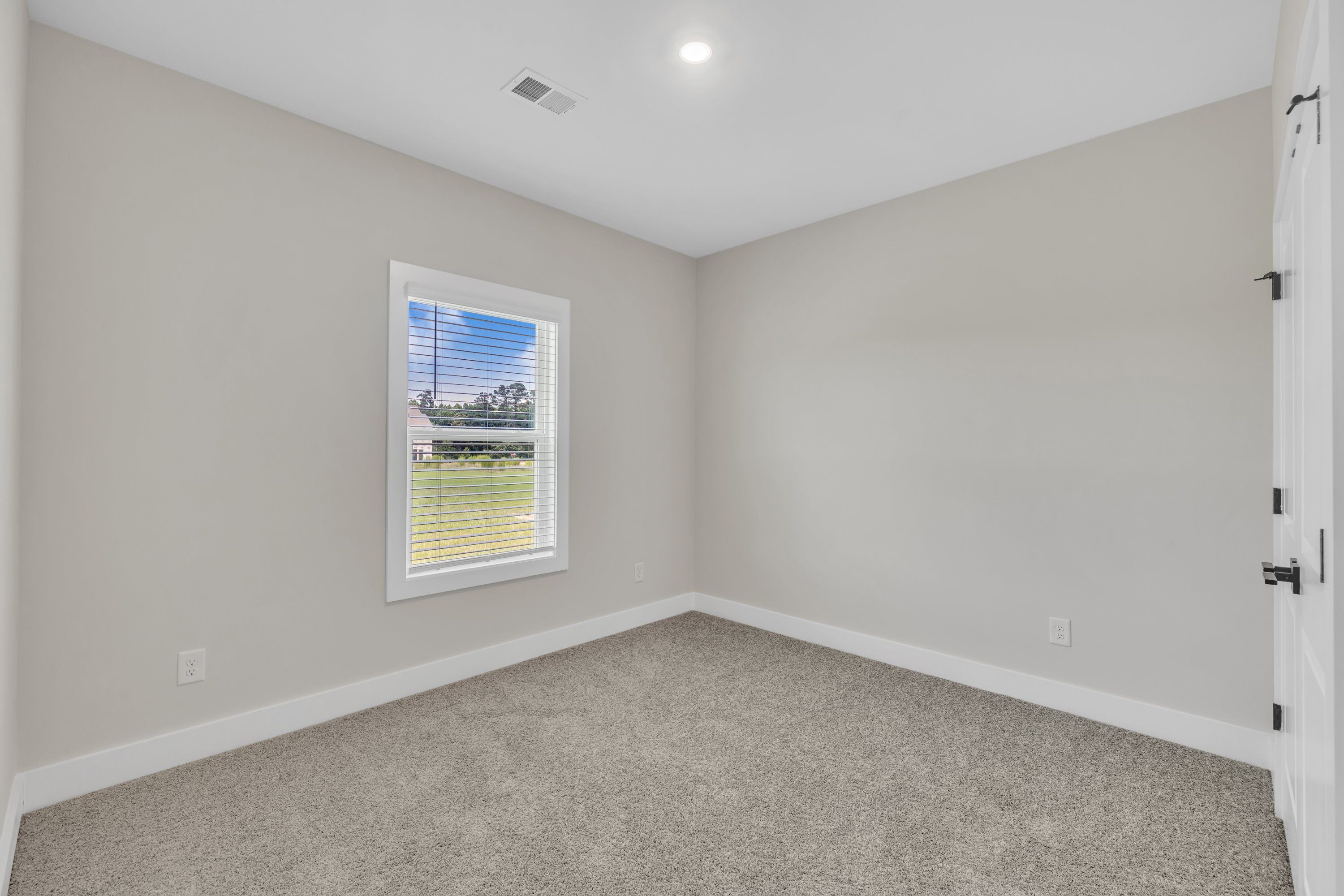 Windows let in lots of light to each bedroom. 