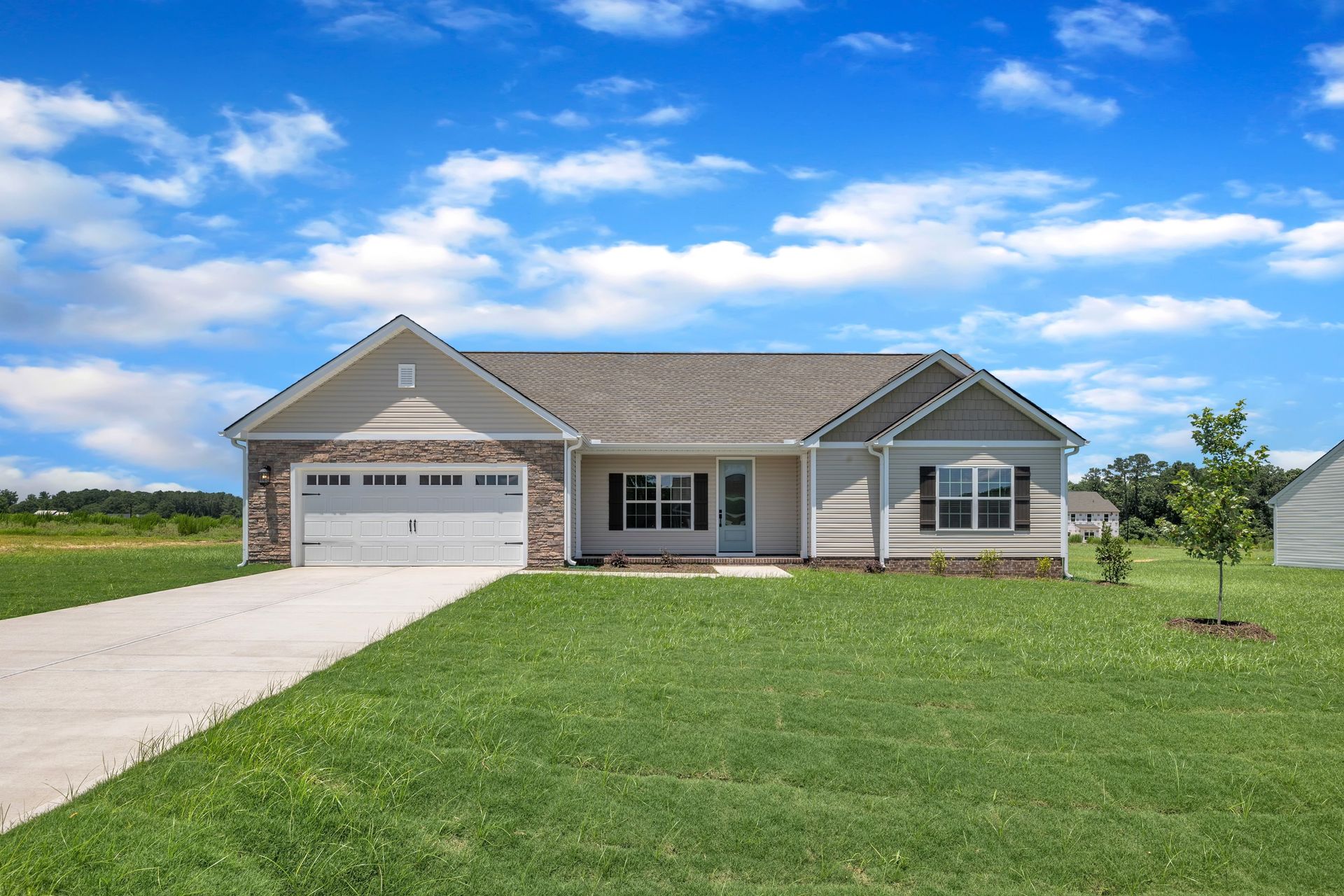 Angled-view of the Taylor with a 2-car garage. 