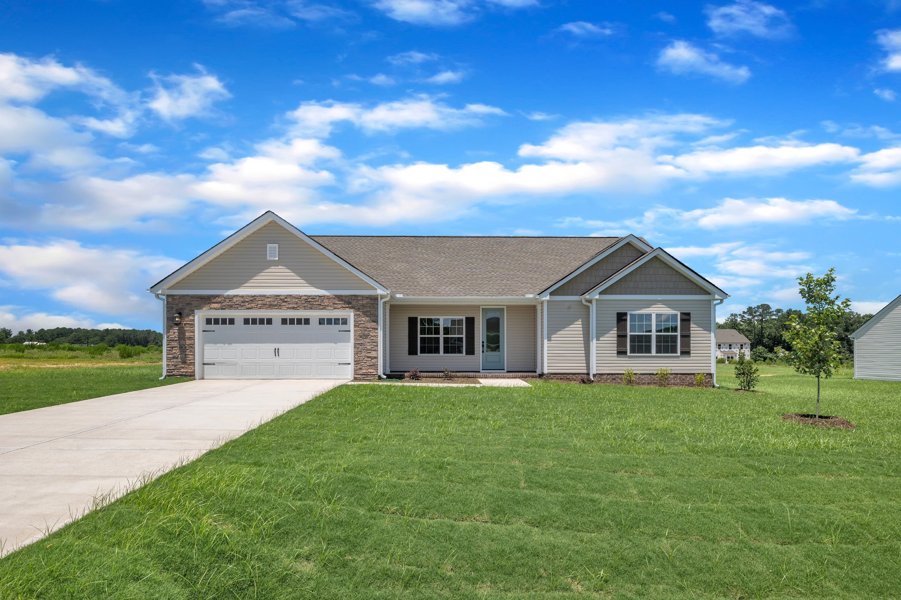 Angled-view of the Taylor with a 2-car garage. 