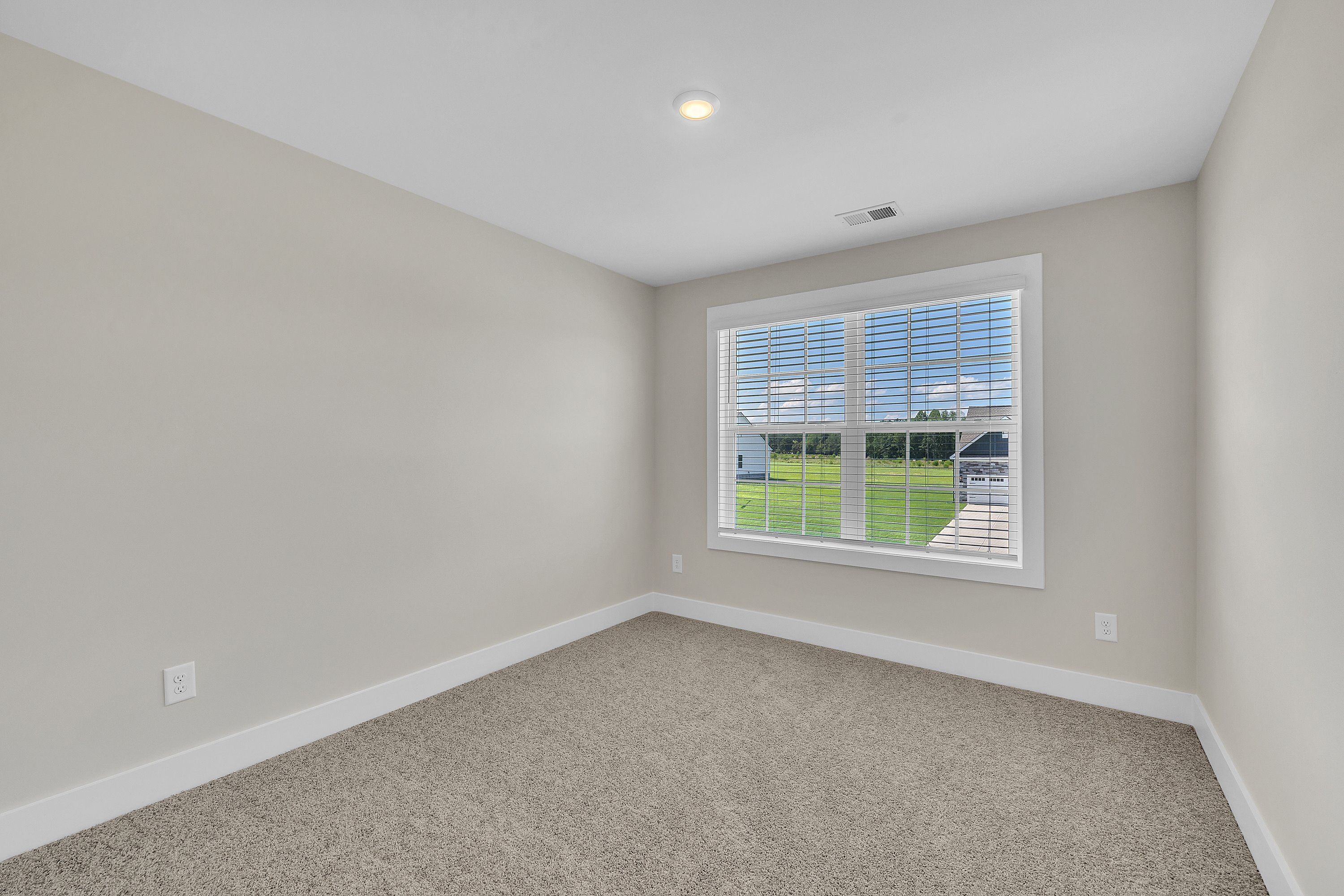 The secondary bathroom has a large soaking tub.
