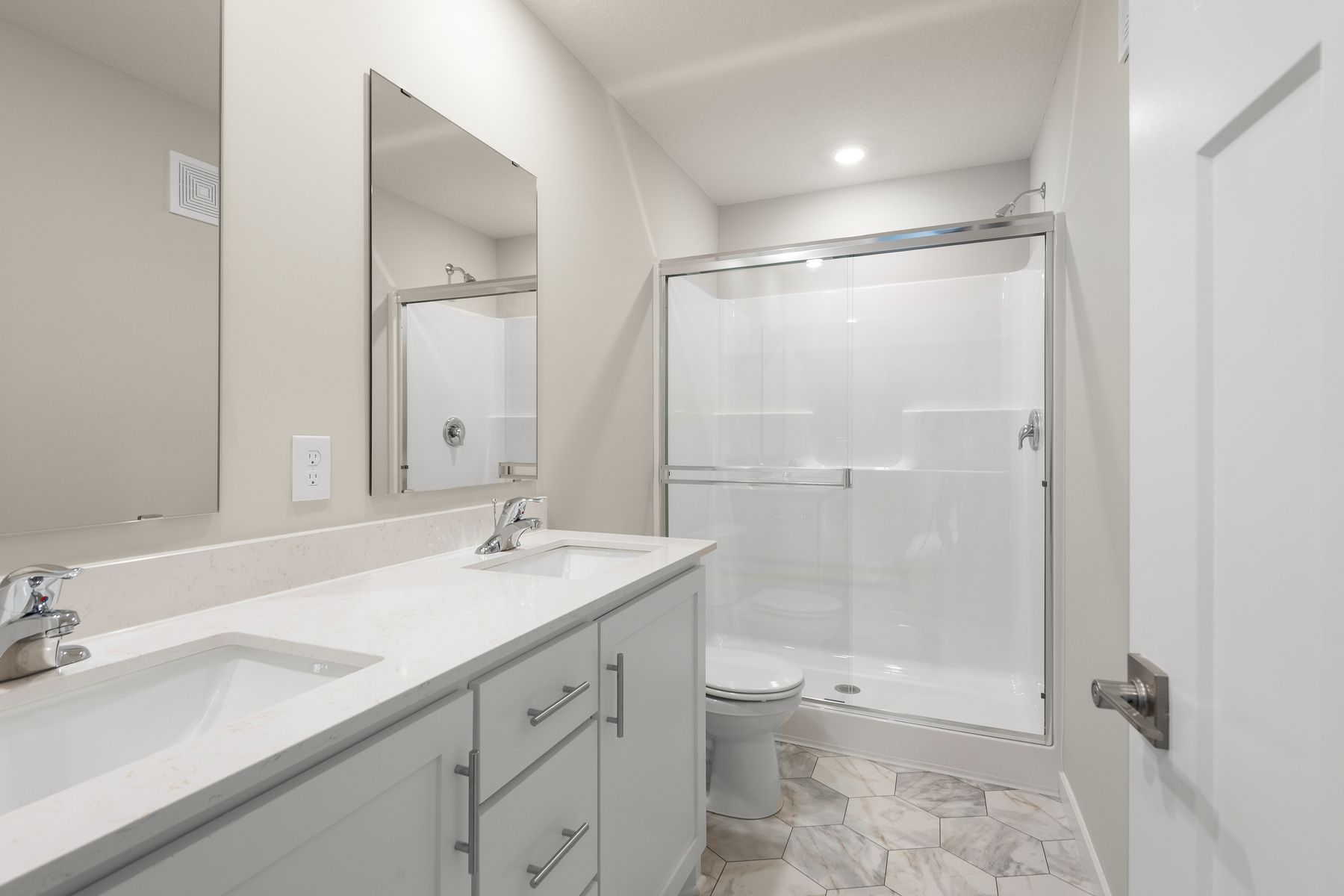 The master bathroom has a step in shower.