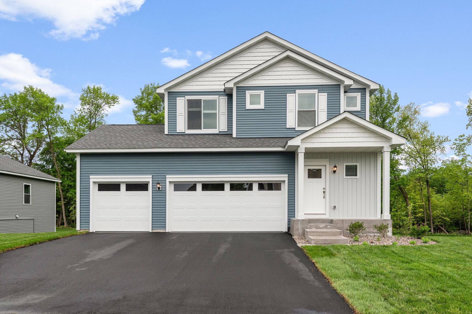 The Granite is a beautiful two story home with siding.