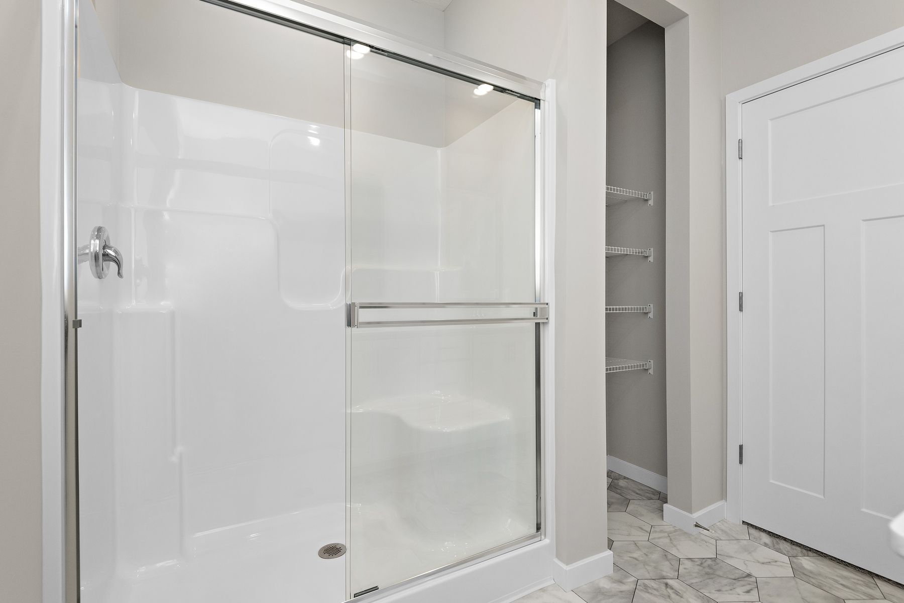 The master bathroom has a step in shower.