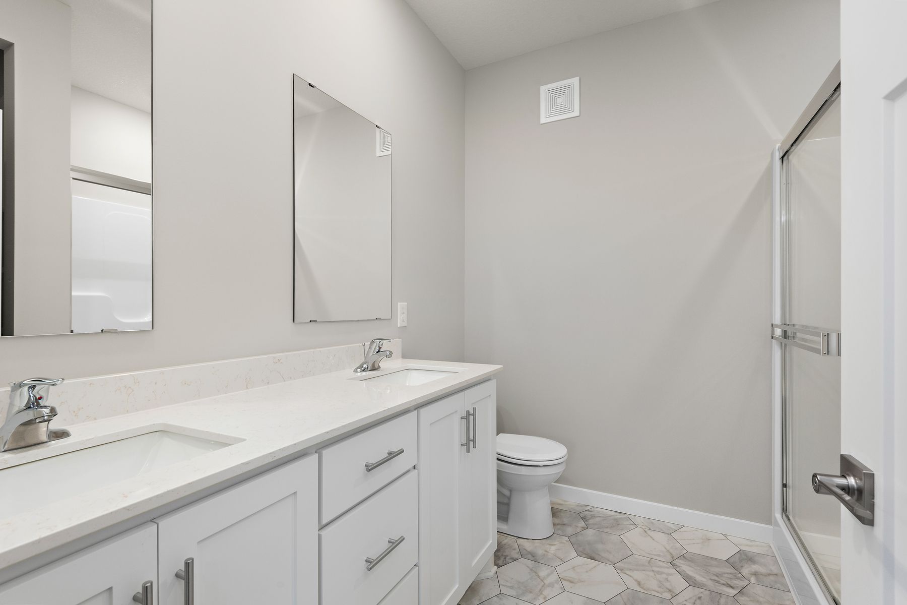The master bathroom has a large vanity.