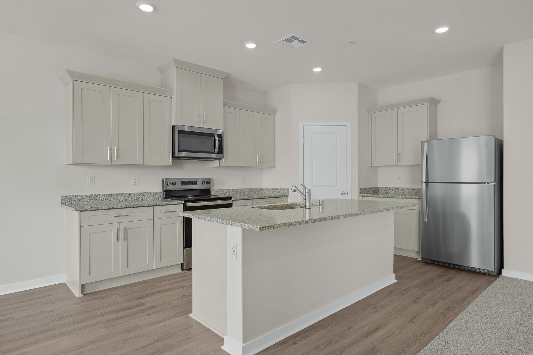 The kitchen appliances come included in this home.