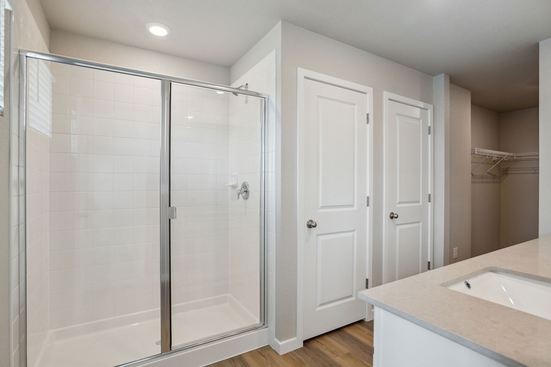 The master bathroom has a step in shower and a soaking tub.