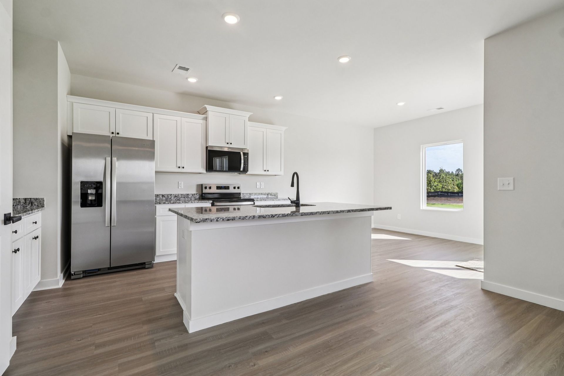 The kitchen has a spacious kitchen island. 