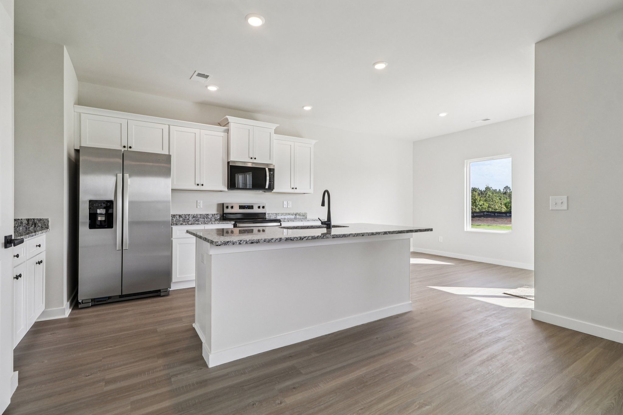 The kitchen has a spacious kitchen island.