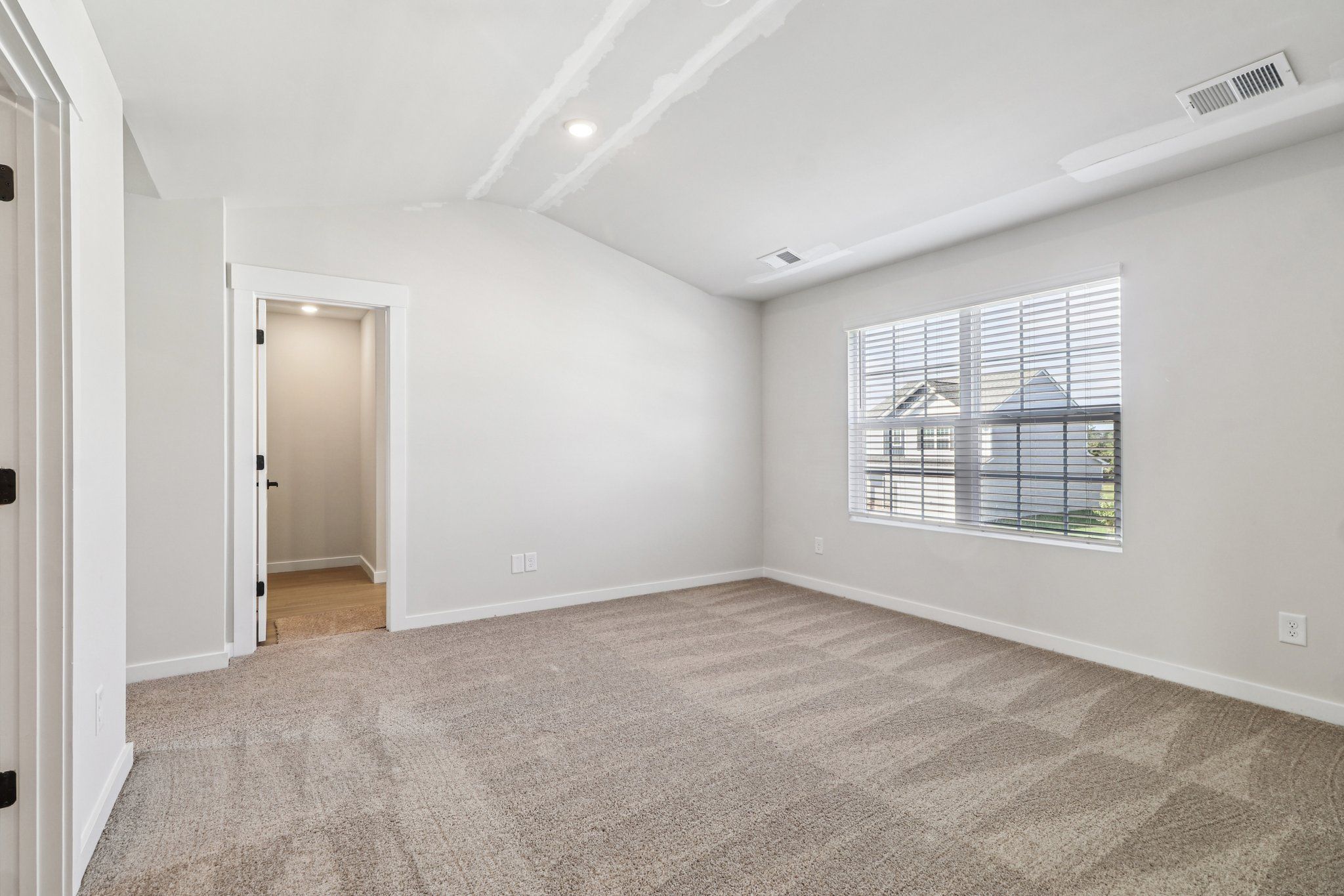 The master bedroom has ample space for your king-sized furniture. 