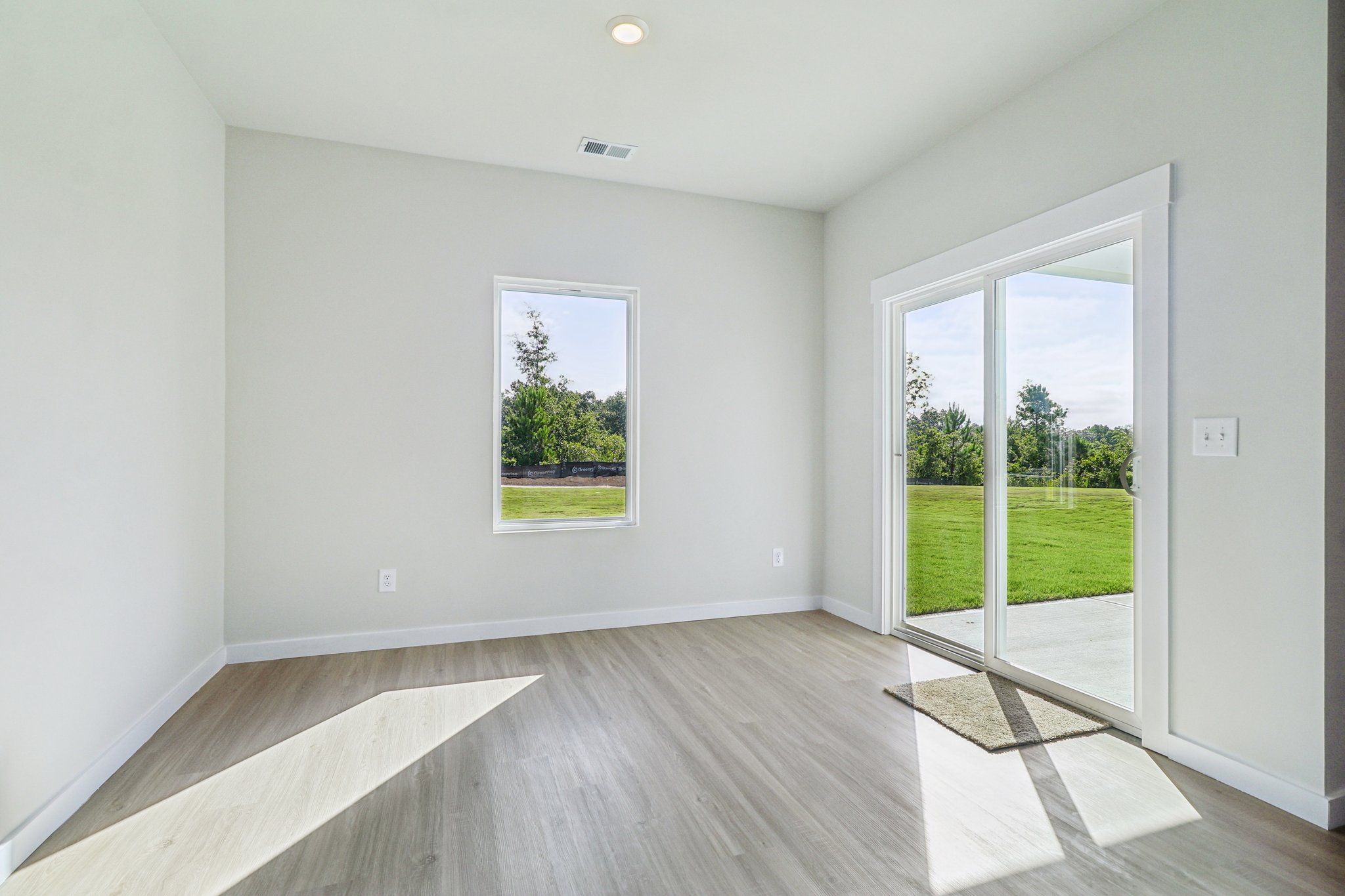 The dining room has a sliding glass door to the back yard