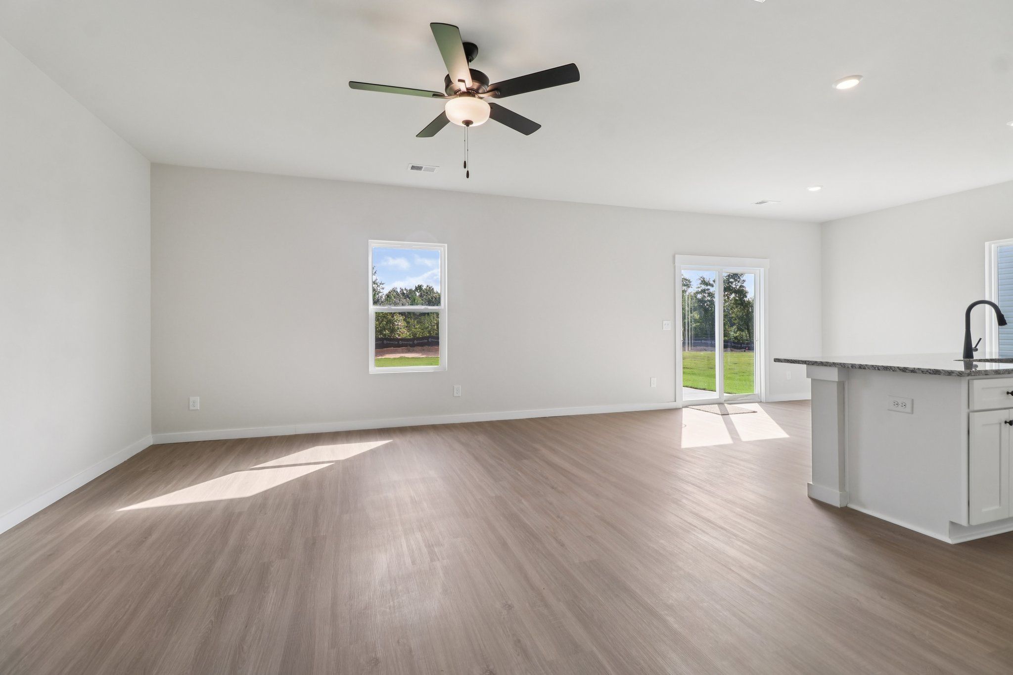 The open layout has the kitchen being open to the family room.