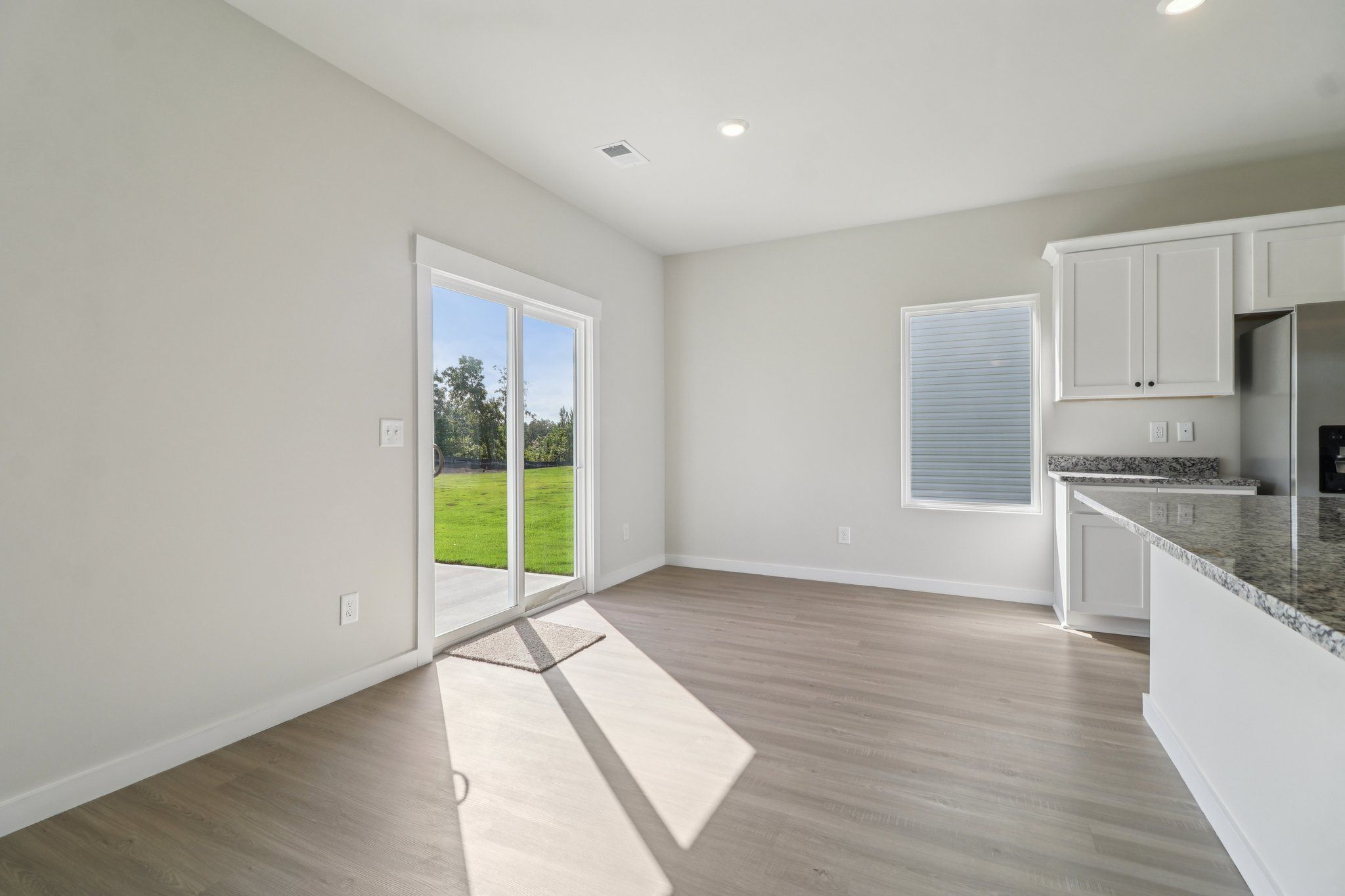The dining room has a sliding glass door to the back yard