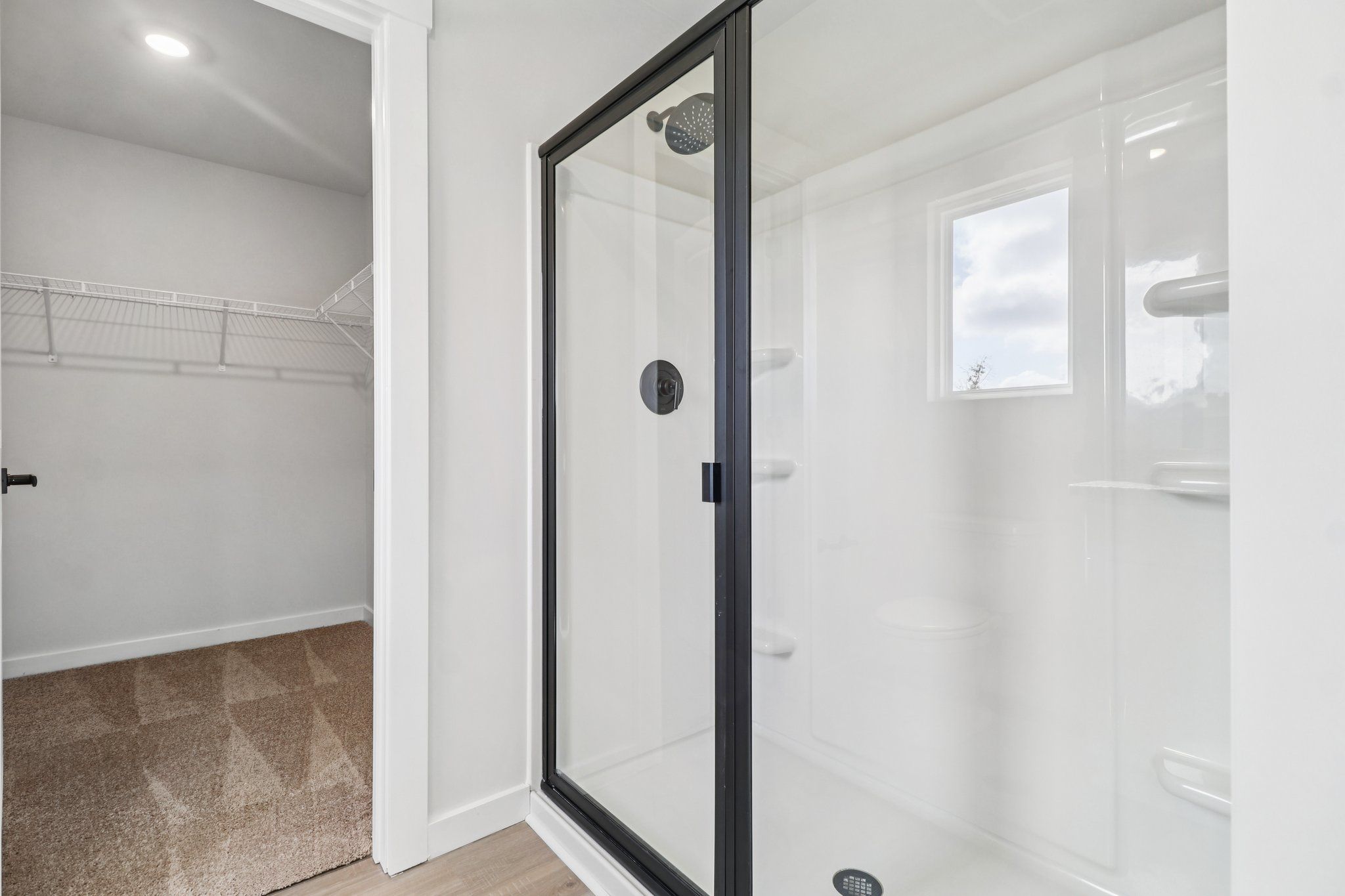 The master has a glass-enclosed shower