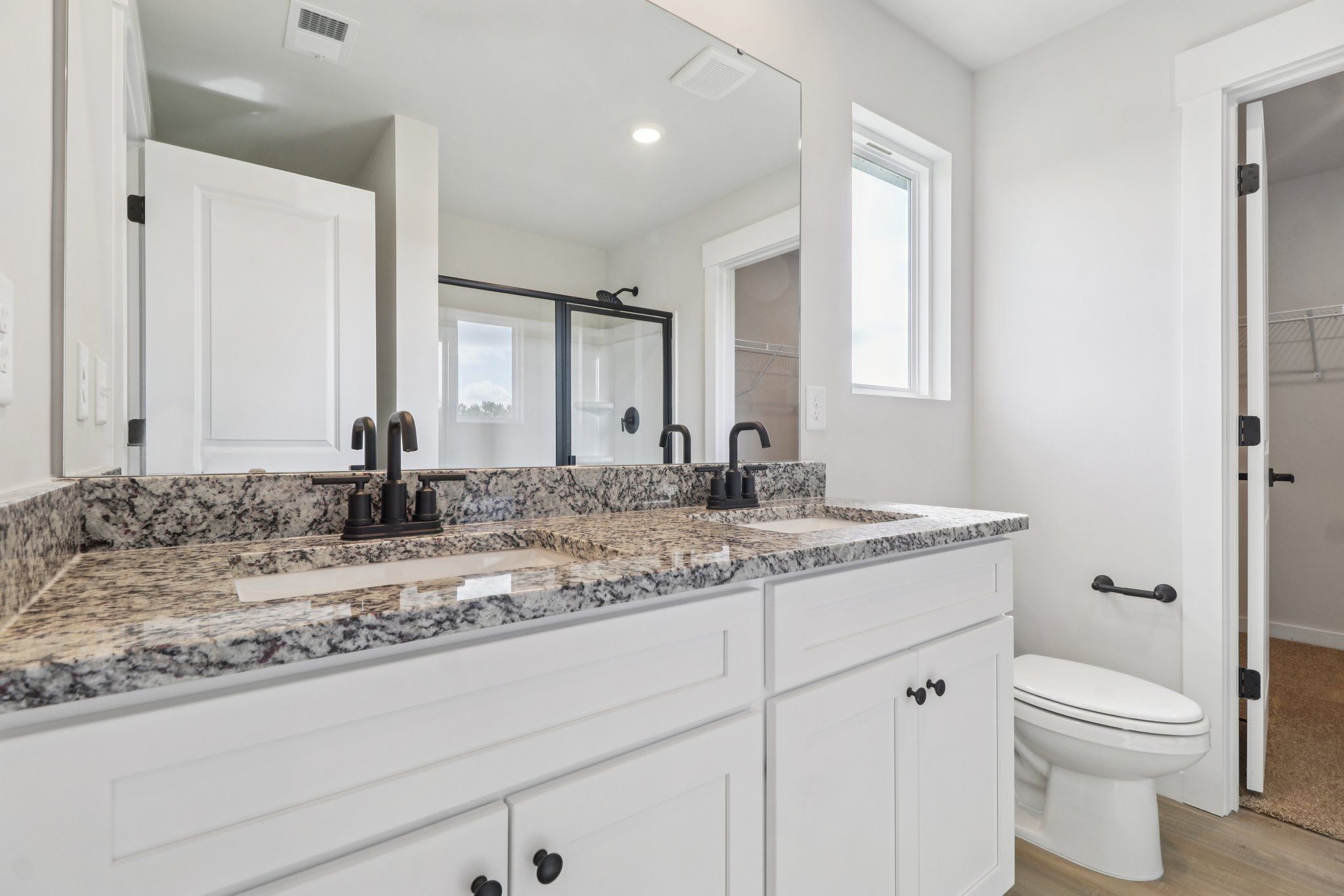 The master bathroom has dual sinks