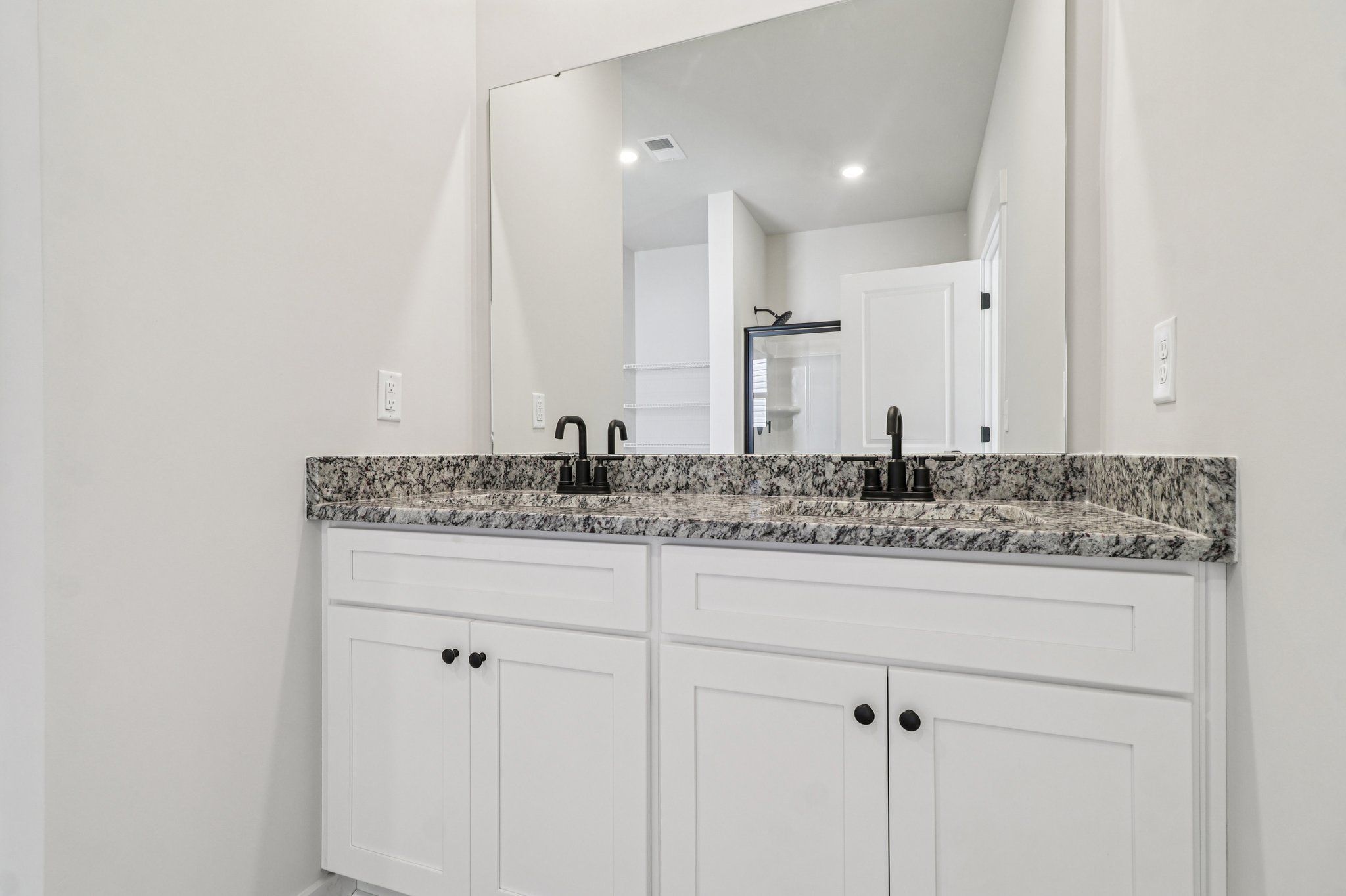 The master bathroom has double sinks