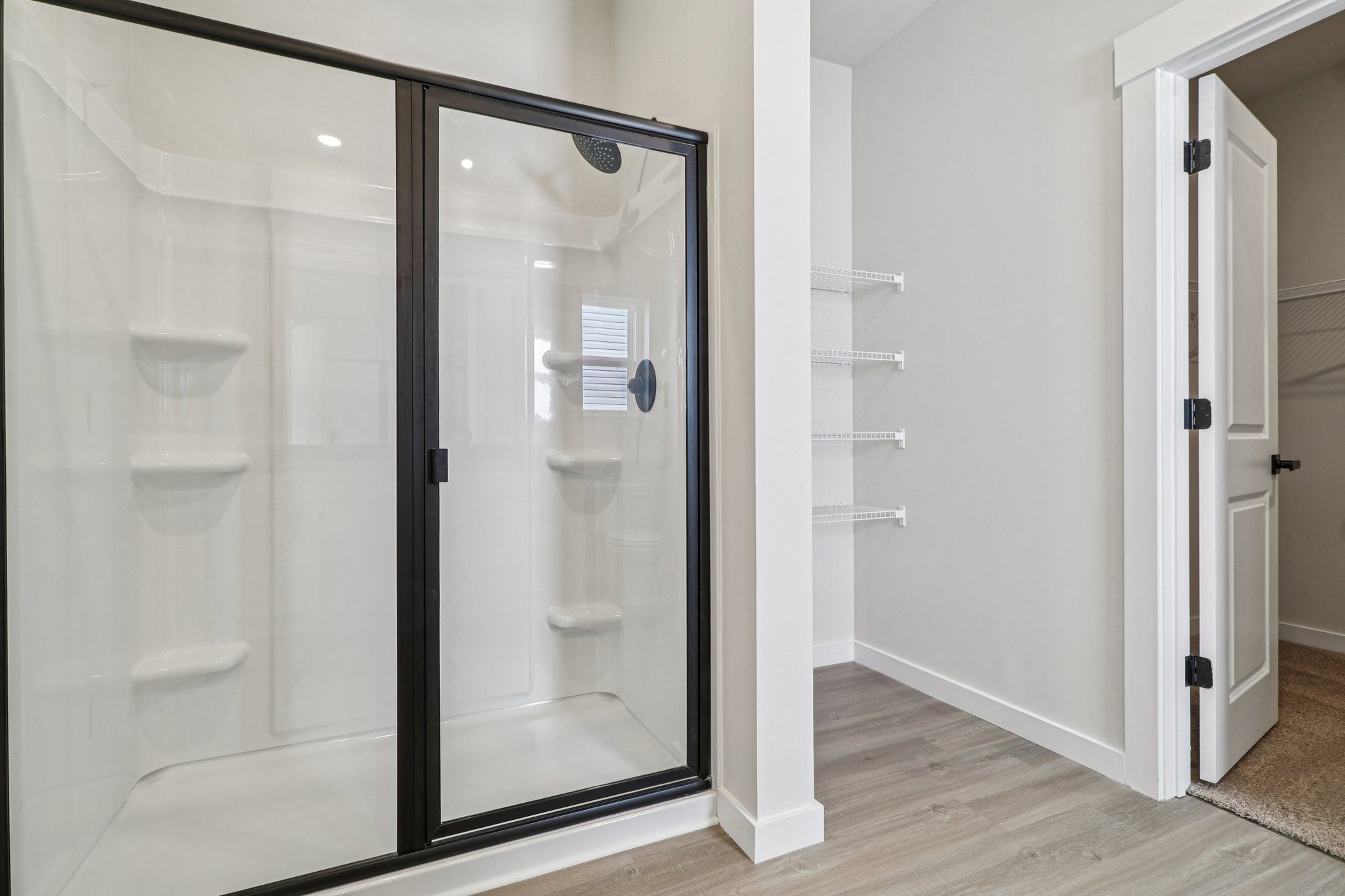 The master has a glass-enclosed shower