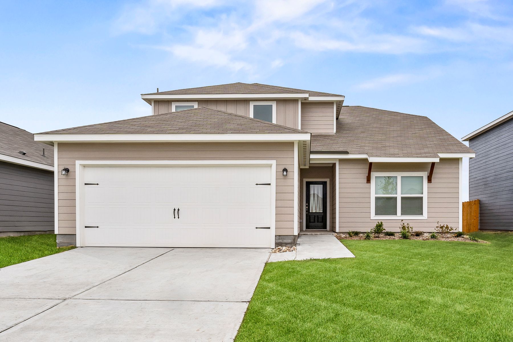 The Cypress is a beautiful one-story siding home with wood detail.