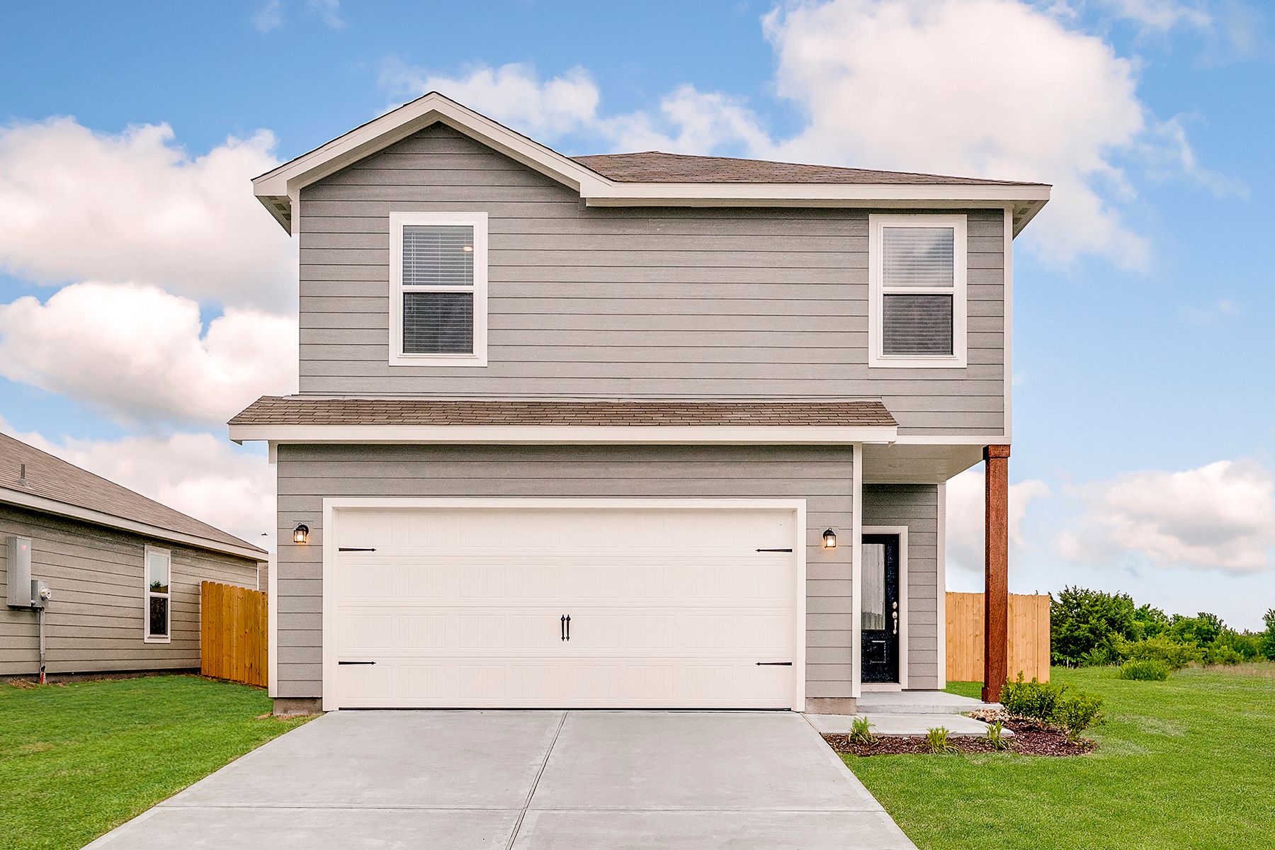 The Jaguar is a beautiful two-story siding home with wood detail.