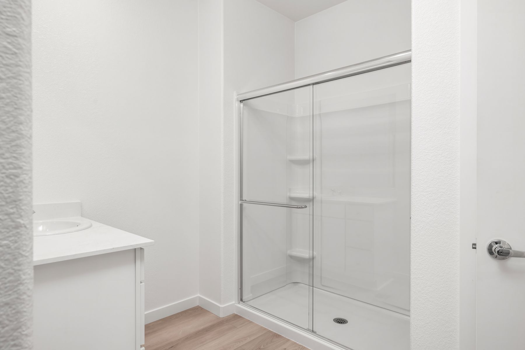 The master bathroom has a dual sink vanity.