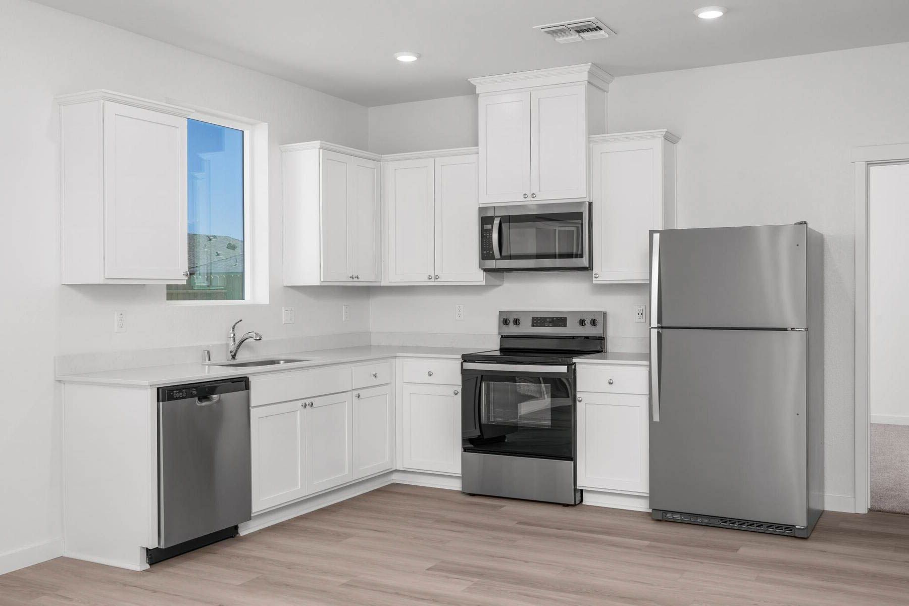 The kitchen appliances come included in this home.