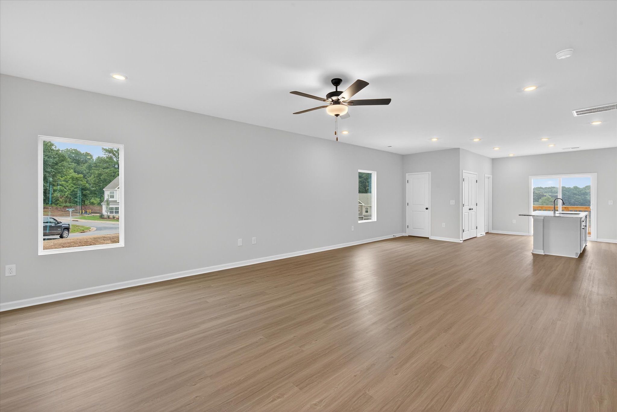The living room has lots of windows