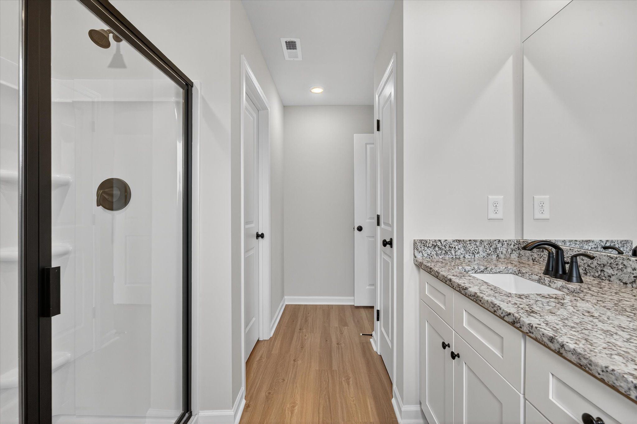 The master bathroom has dual vanities.