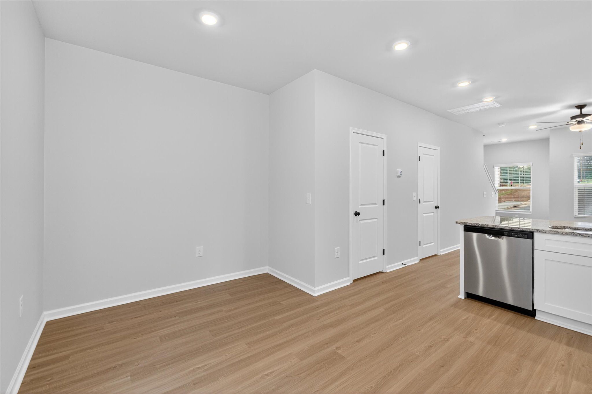 The dining room is off of the kitchen. 