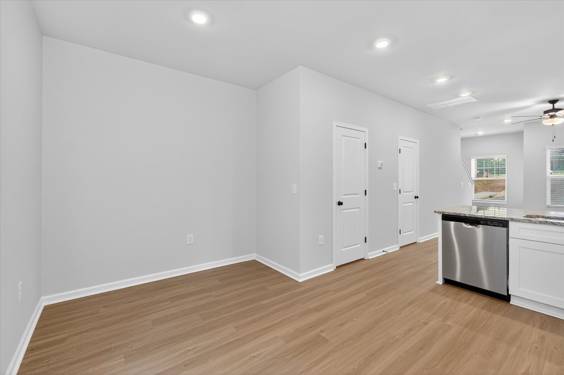The dining room is off of the kitchen. 