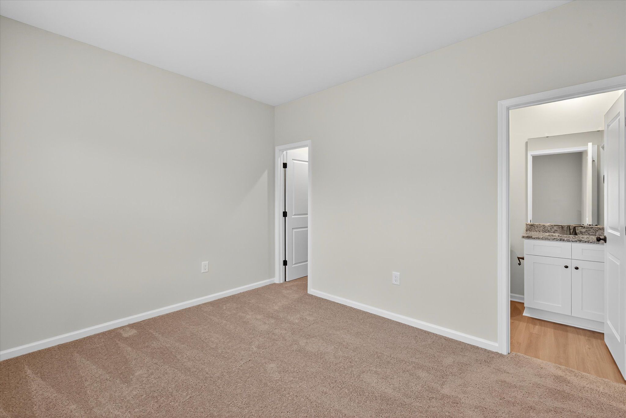 Tall ceilings and large windows in the master bedroom. 