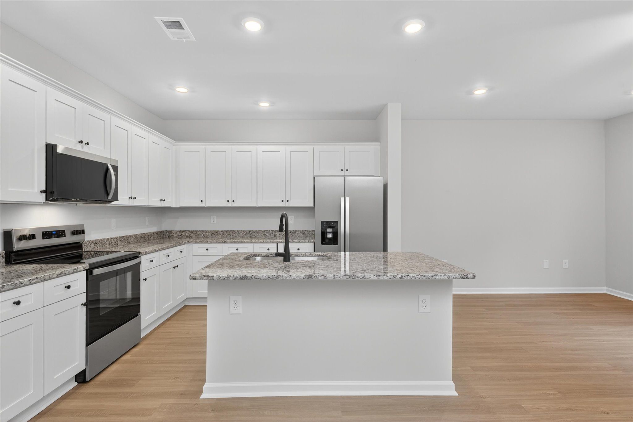 The kitchen comes with stainless-steel appliances. 