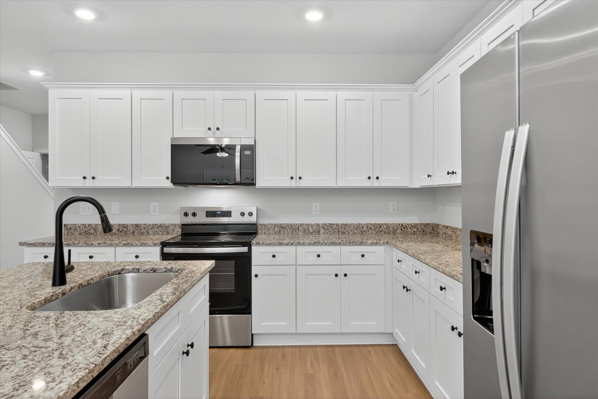 The kitchen has granite countertops. 