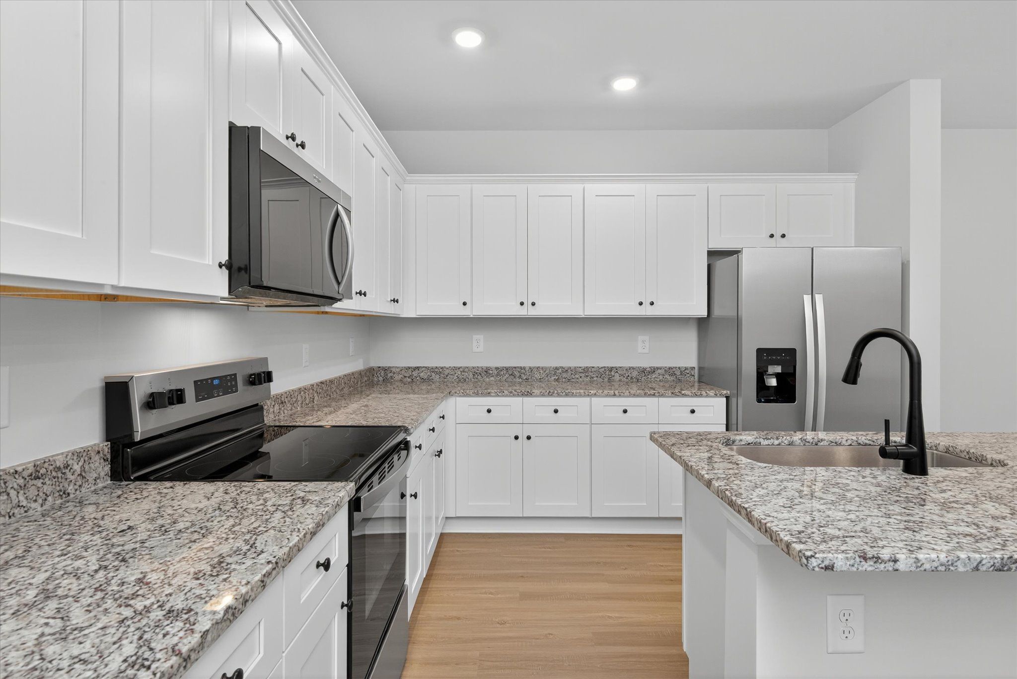 The kitchen comes with stainless-steel appliances. 