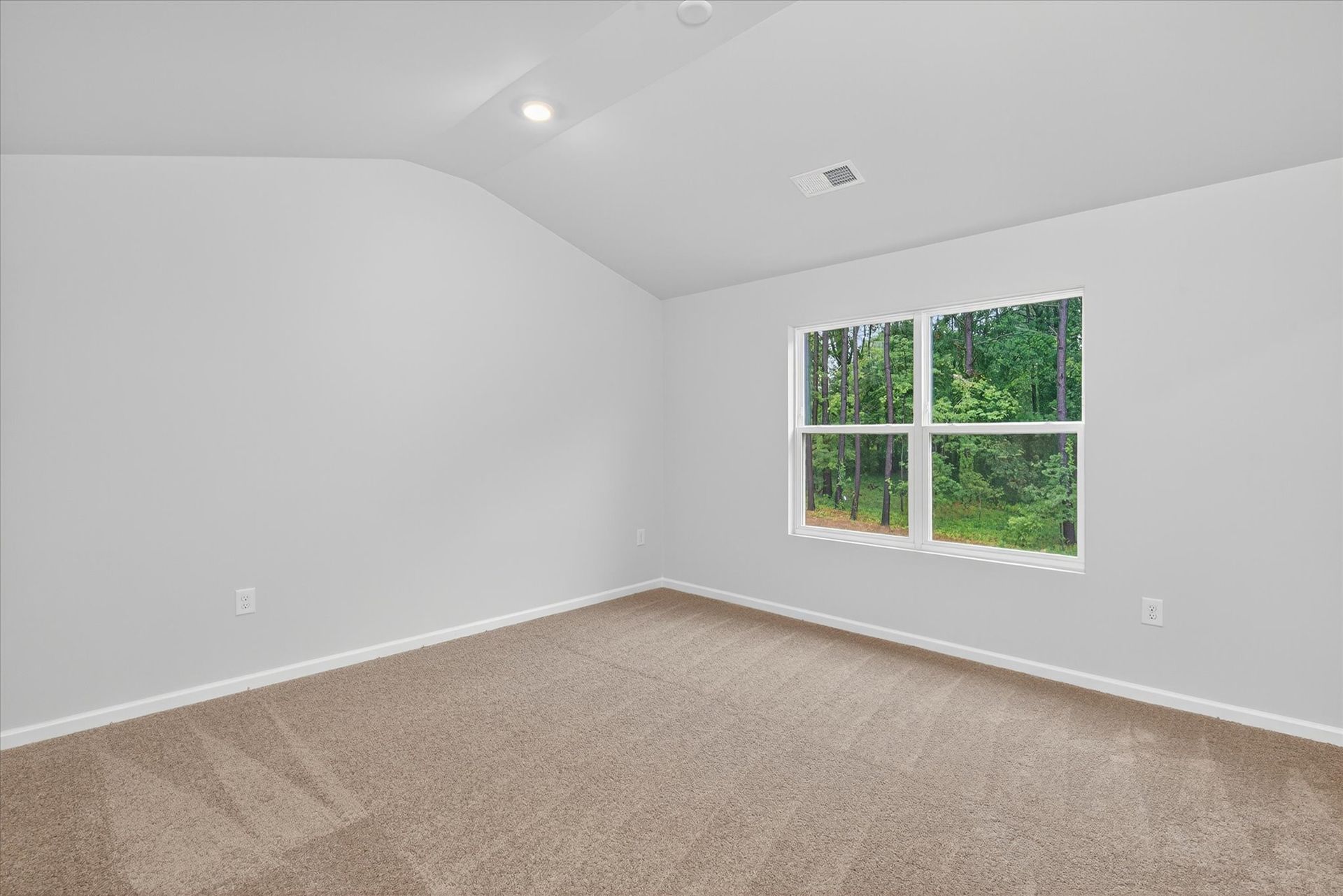 Windows let in lots of light to the master bedroom
