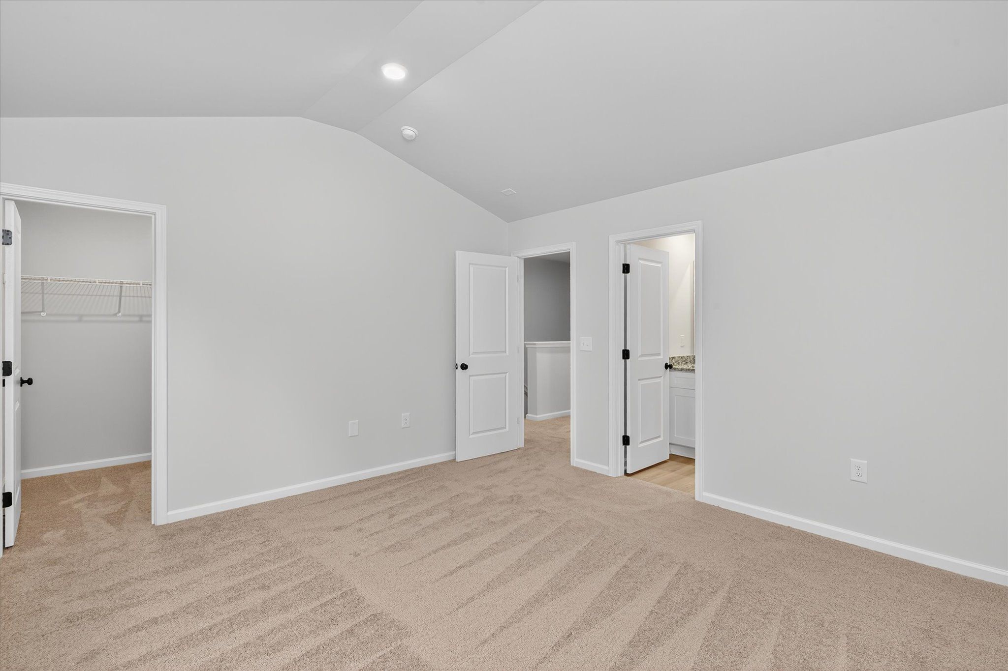 Tall ceilings and large windows in the master bedroom. 