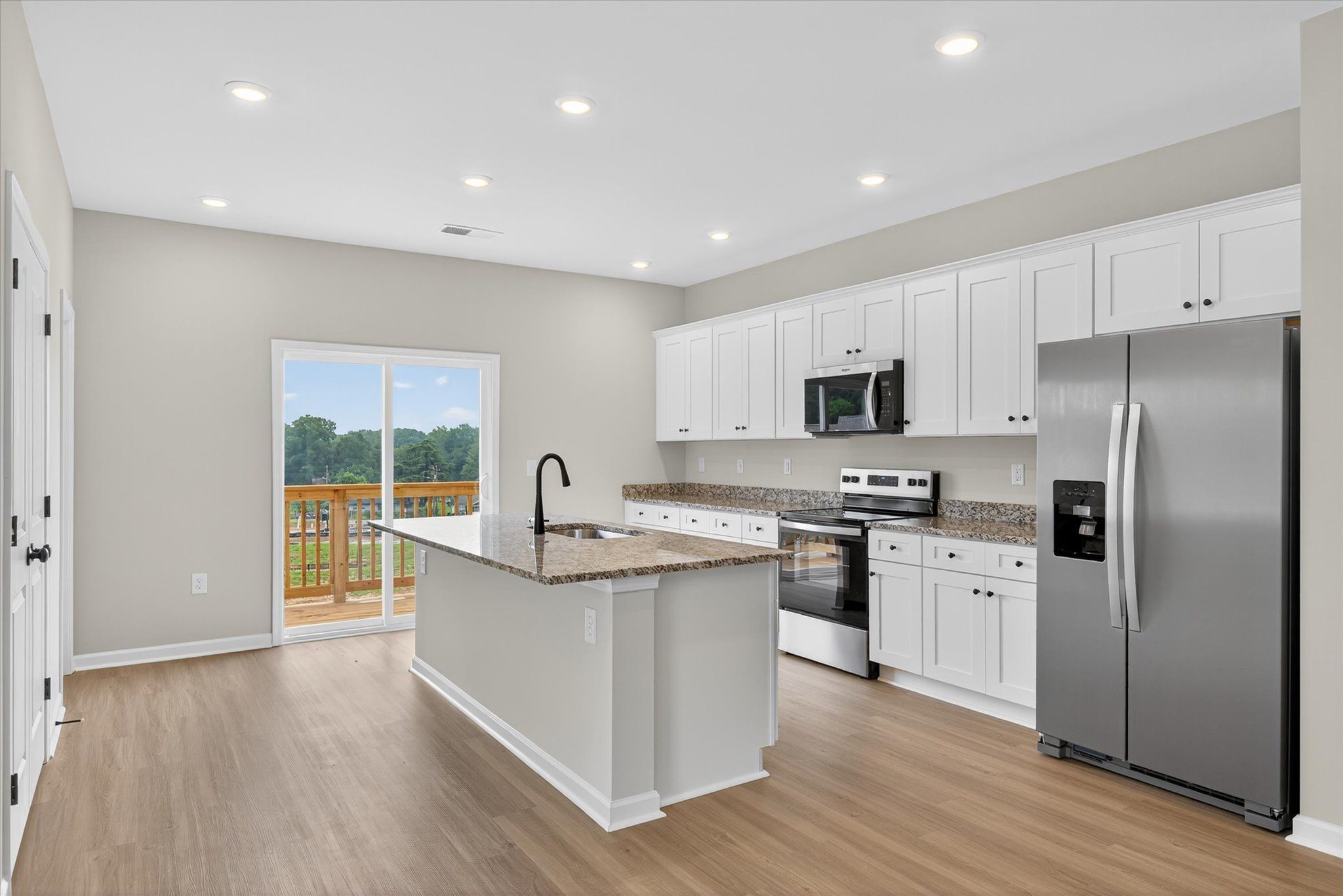 The kitchen comes with stainless-steel appliances. 