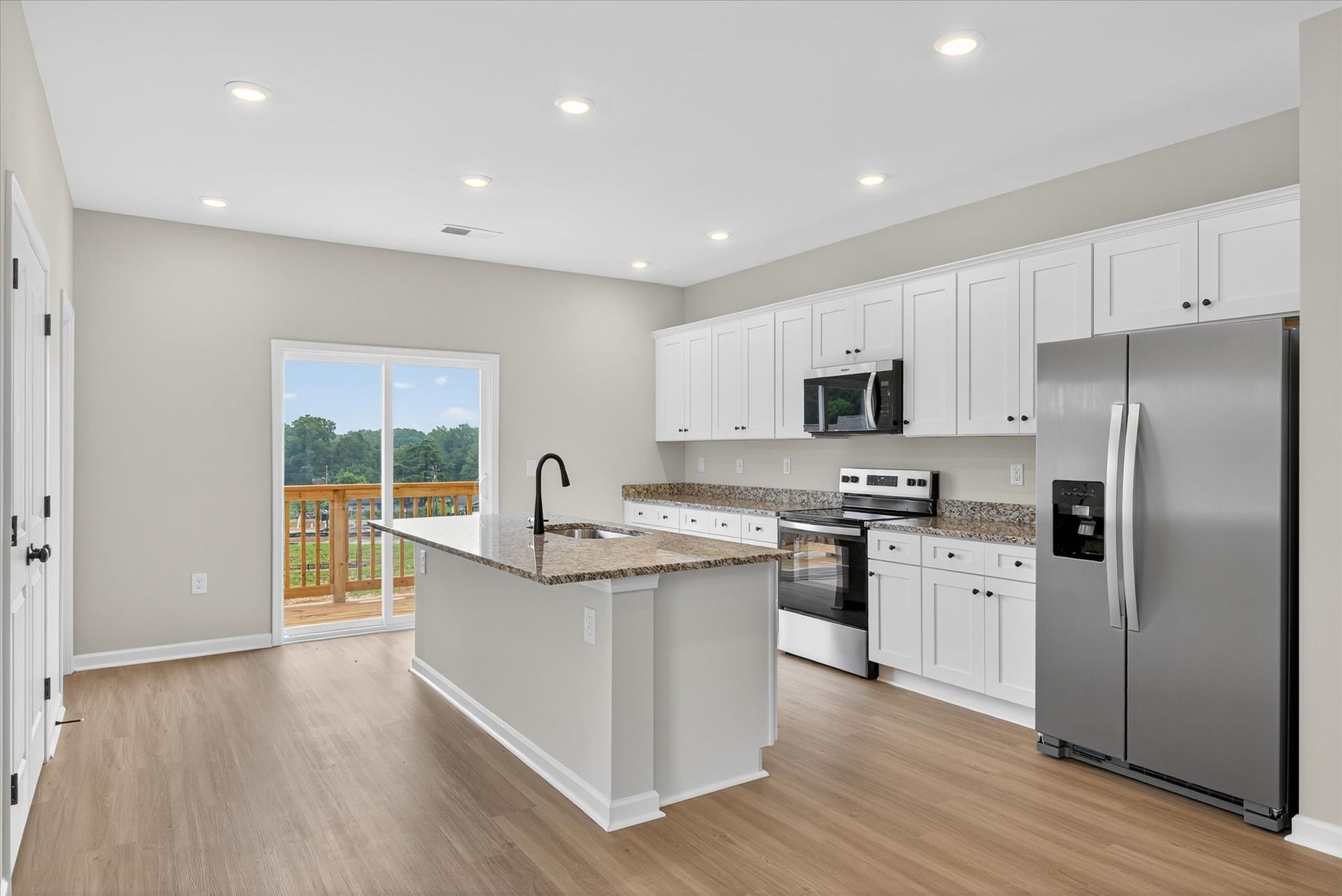 The kitchen comes with stainless-steel appliances. 
