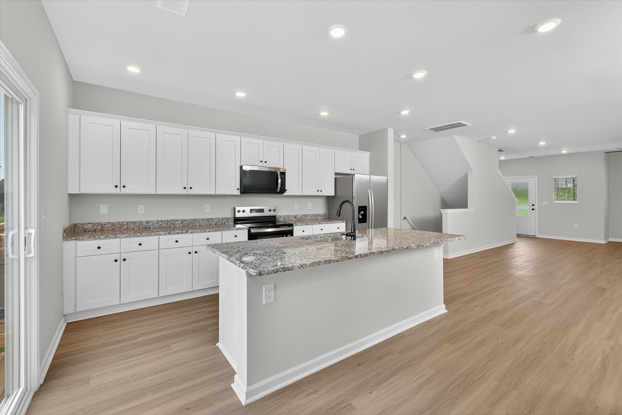 The kitchen comes with stainless-steel appliances. 