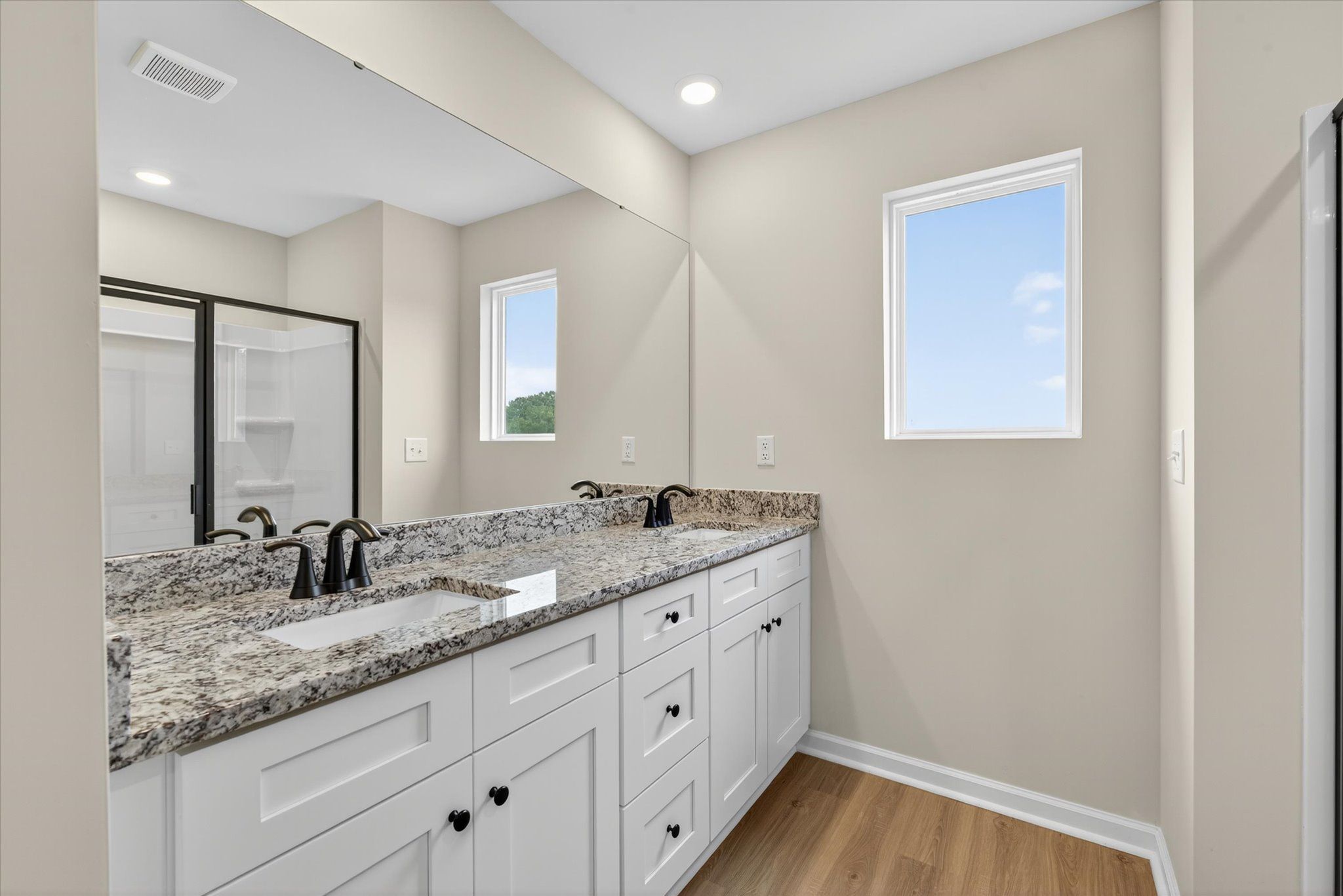 The master bathroom has dual vanities. 