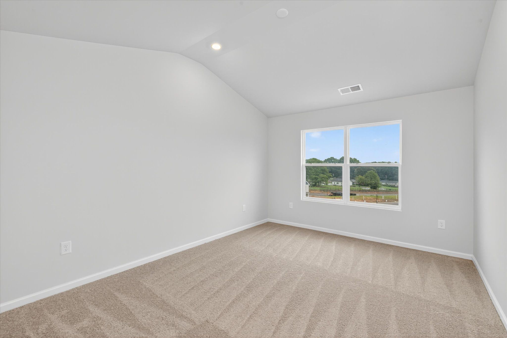 The master bedroom has plenty of space for your furniture