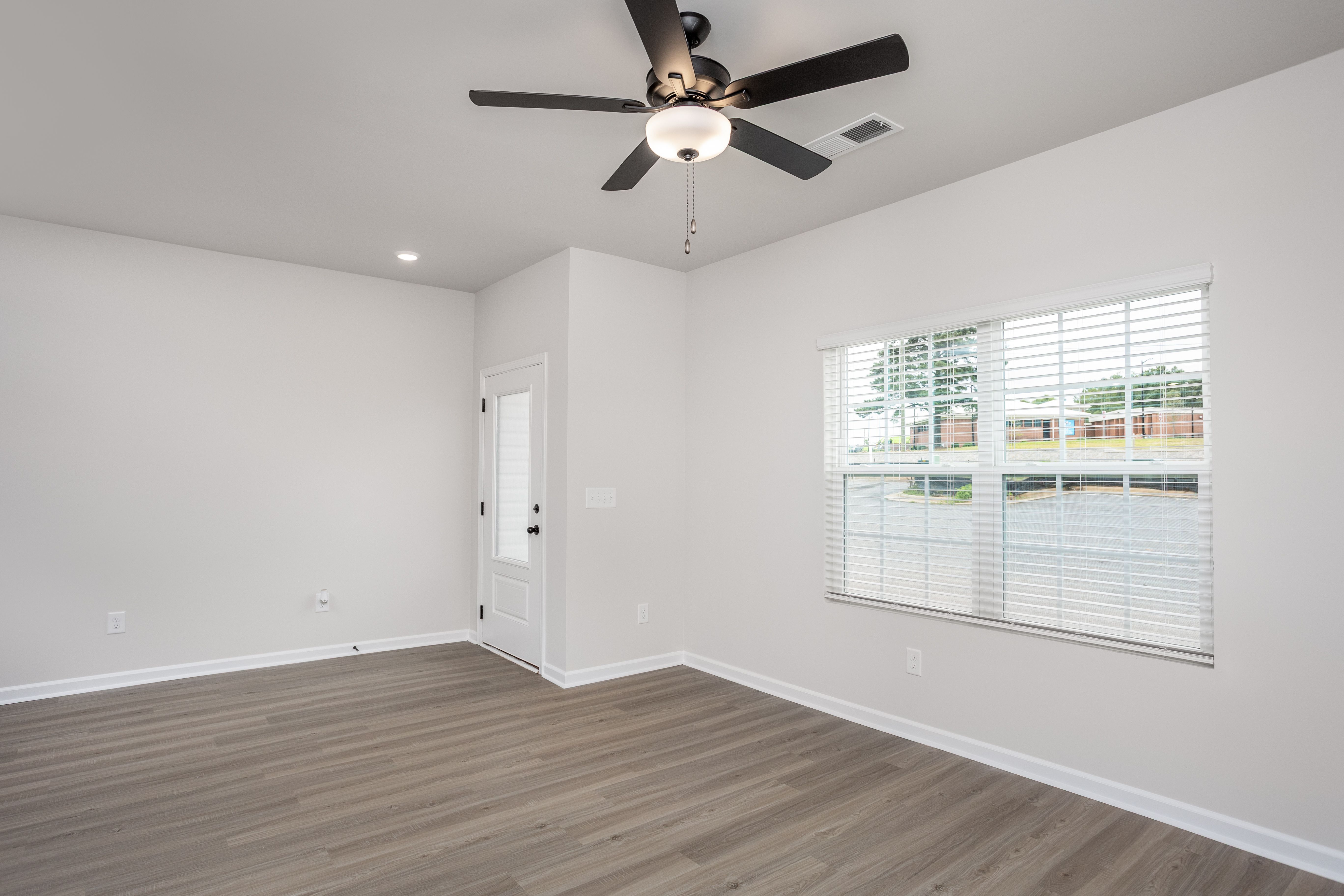 Windows let in lots of light to the living room. 