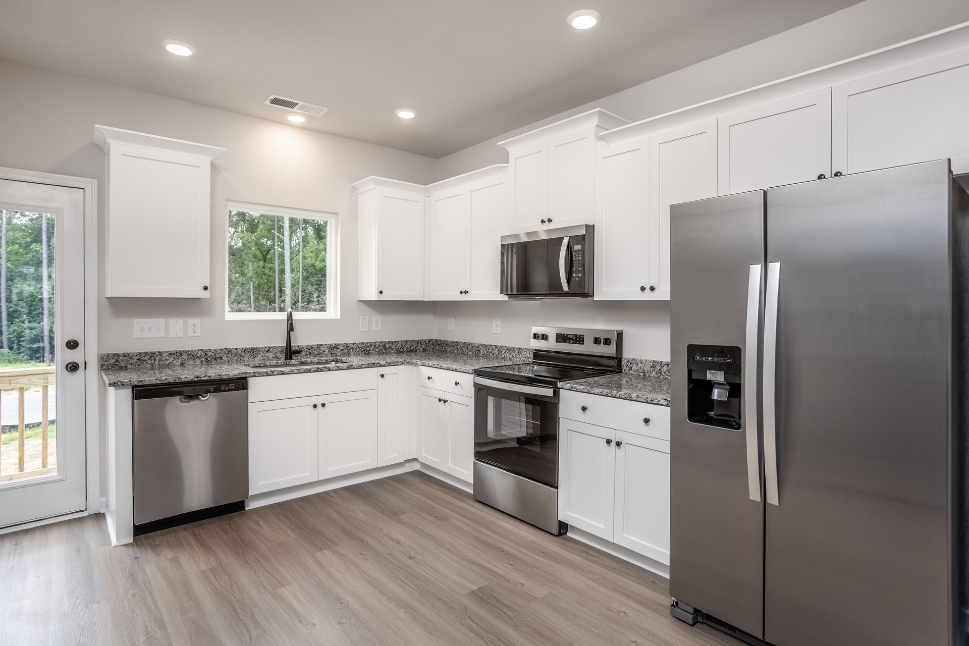 The kitchen has granite countertops. 