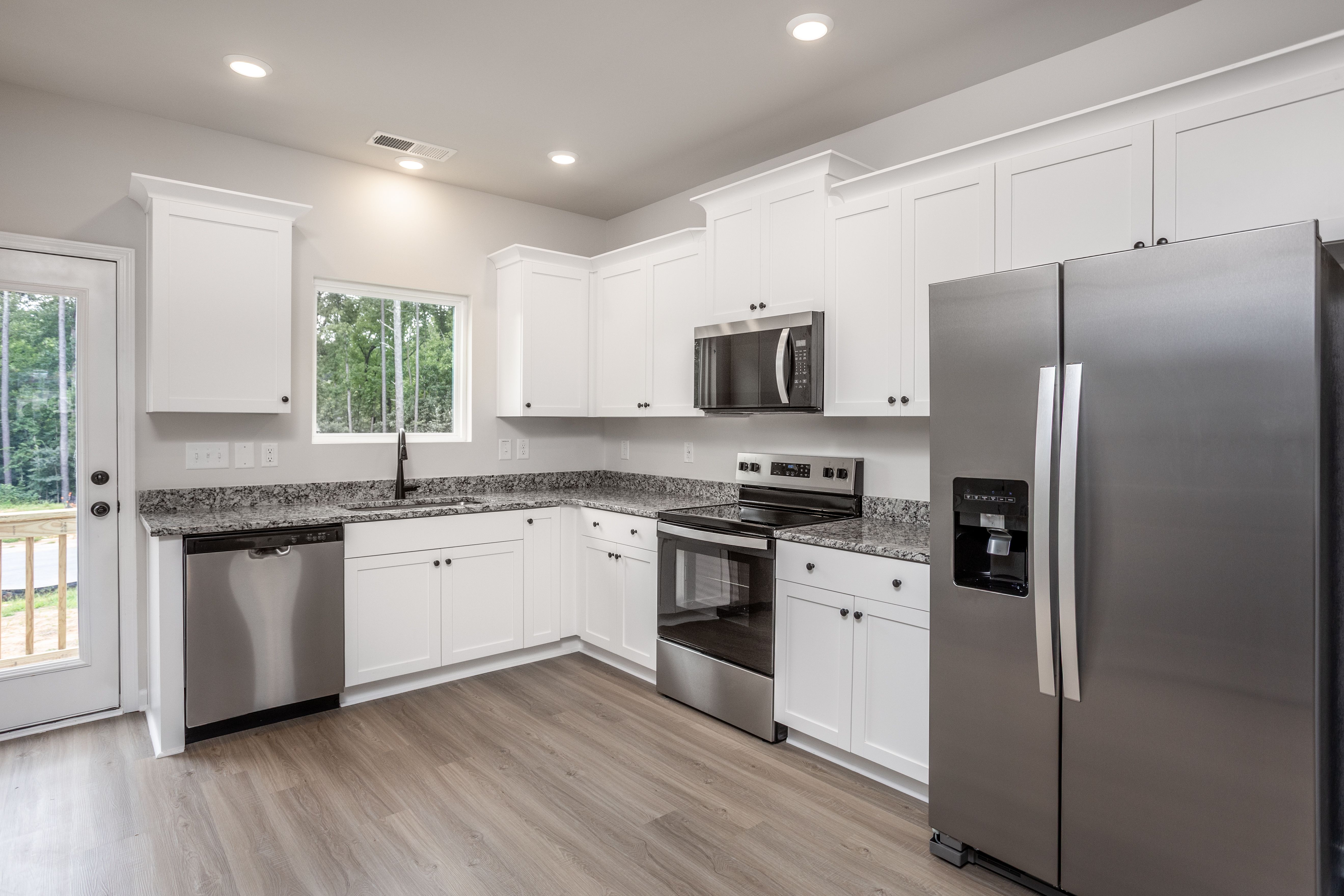 The kitchen has granite countertops. 
