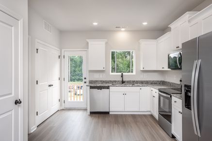 The living room connects to the kitchen.