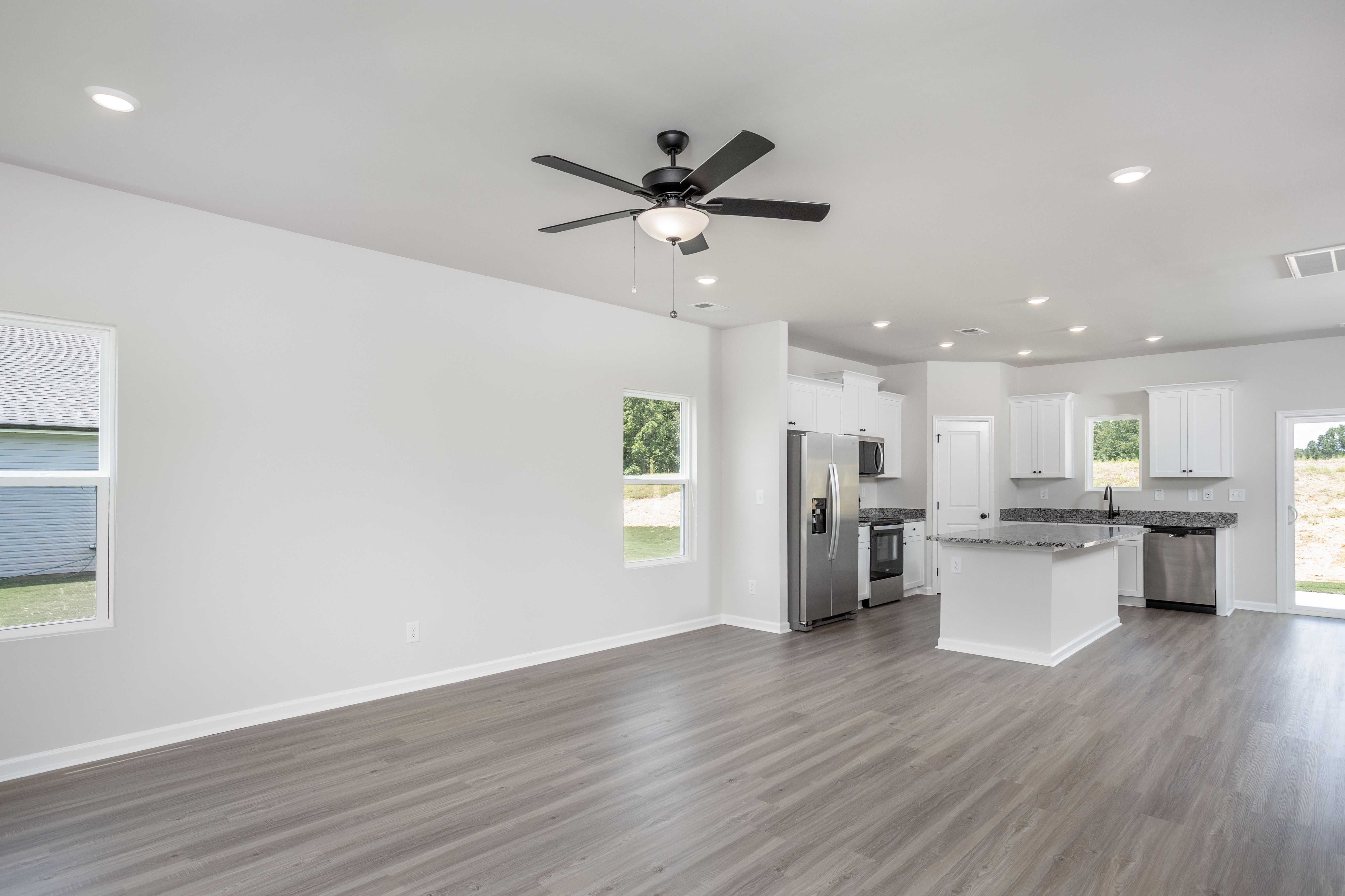 Living room has vinyl plank flooring