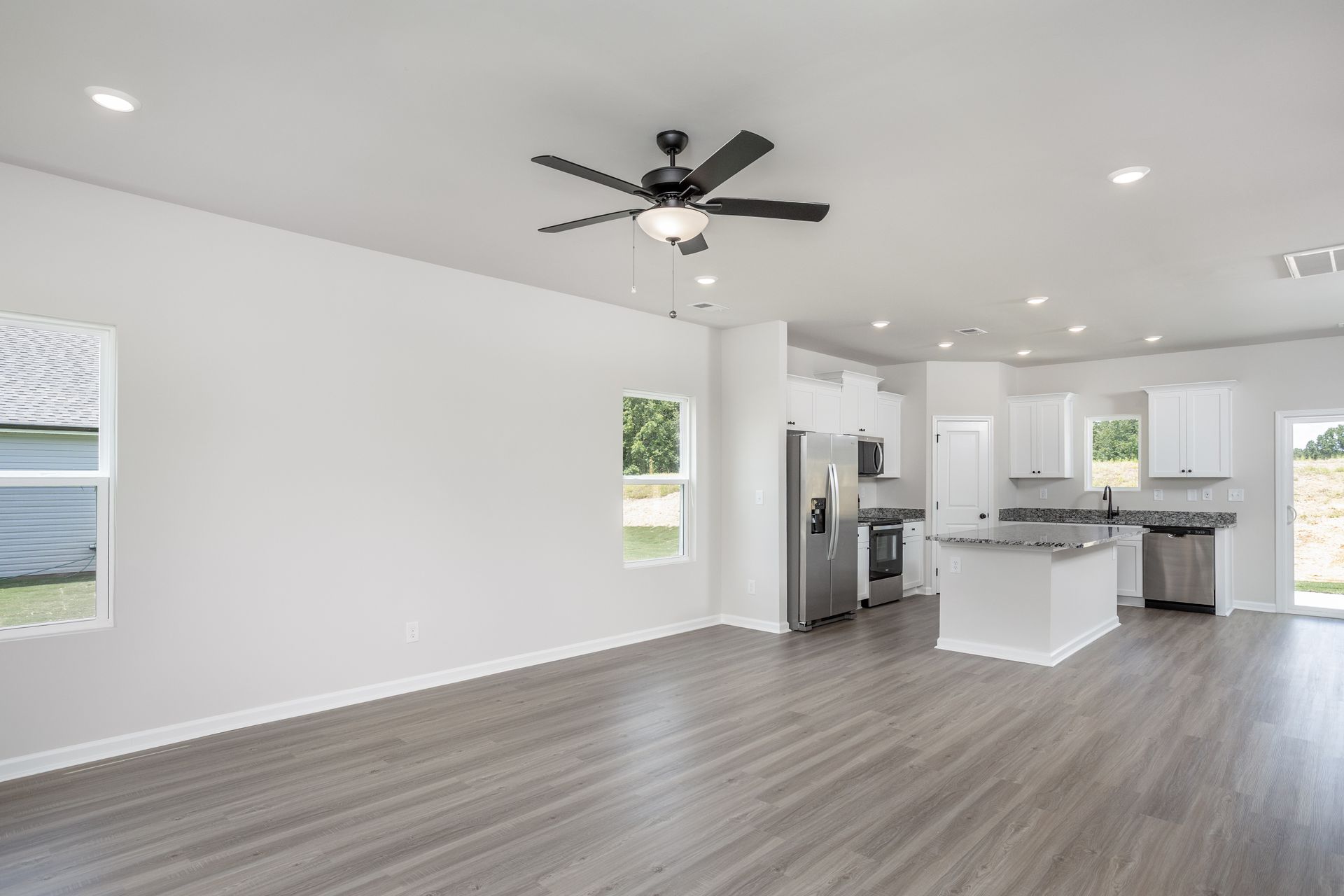 Living room has vinyl plank flooring